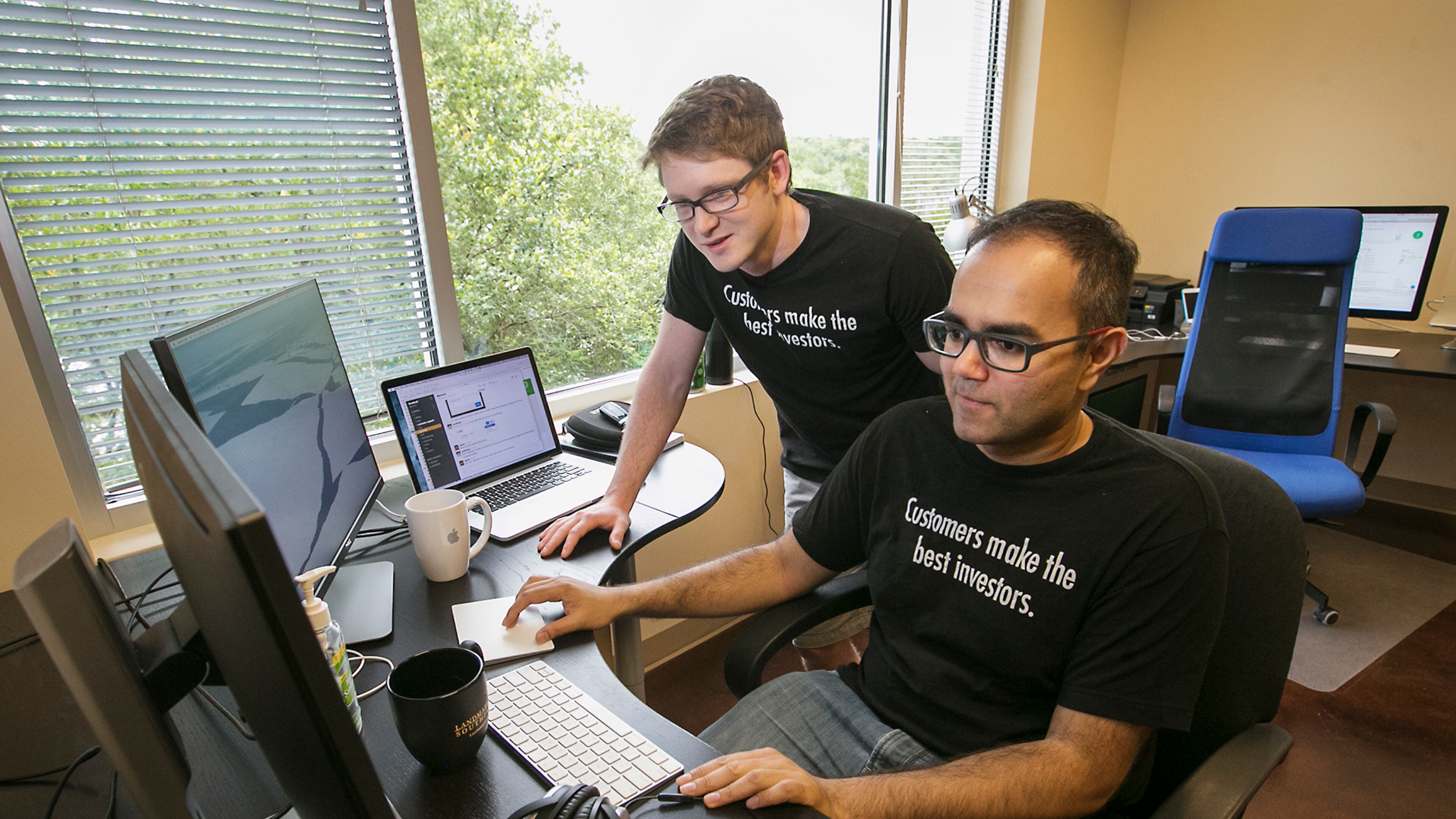Jared King, left, and Parag Patel, right, are co-founders of Invoiced, their bootstrap startup they created with little money or overhead. The partners work out of leased offices within a medical business in southwest Austin.
RALPH BARRERA/AMERICAN-STATESMAN