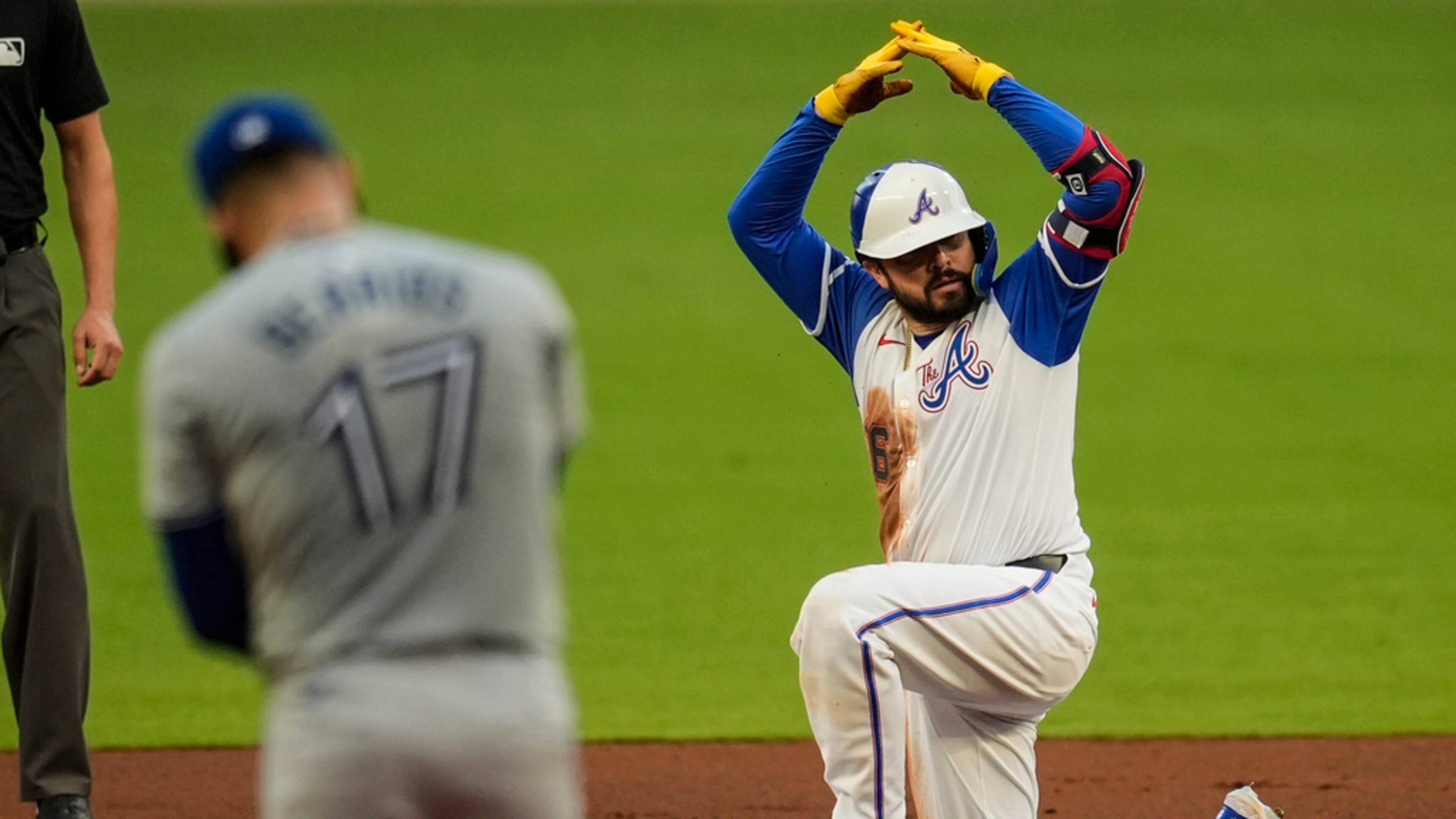 Atlanta Braves' Travis d'Arnaud (16) celebrates after hitting a double against the Toronto Blue Jays on Saturday, Sept. 7, 2024, in Atlanta. (AP Photo/Mike Stewart)
