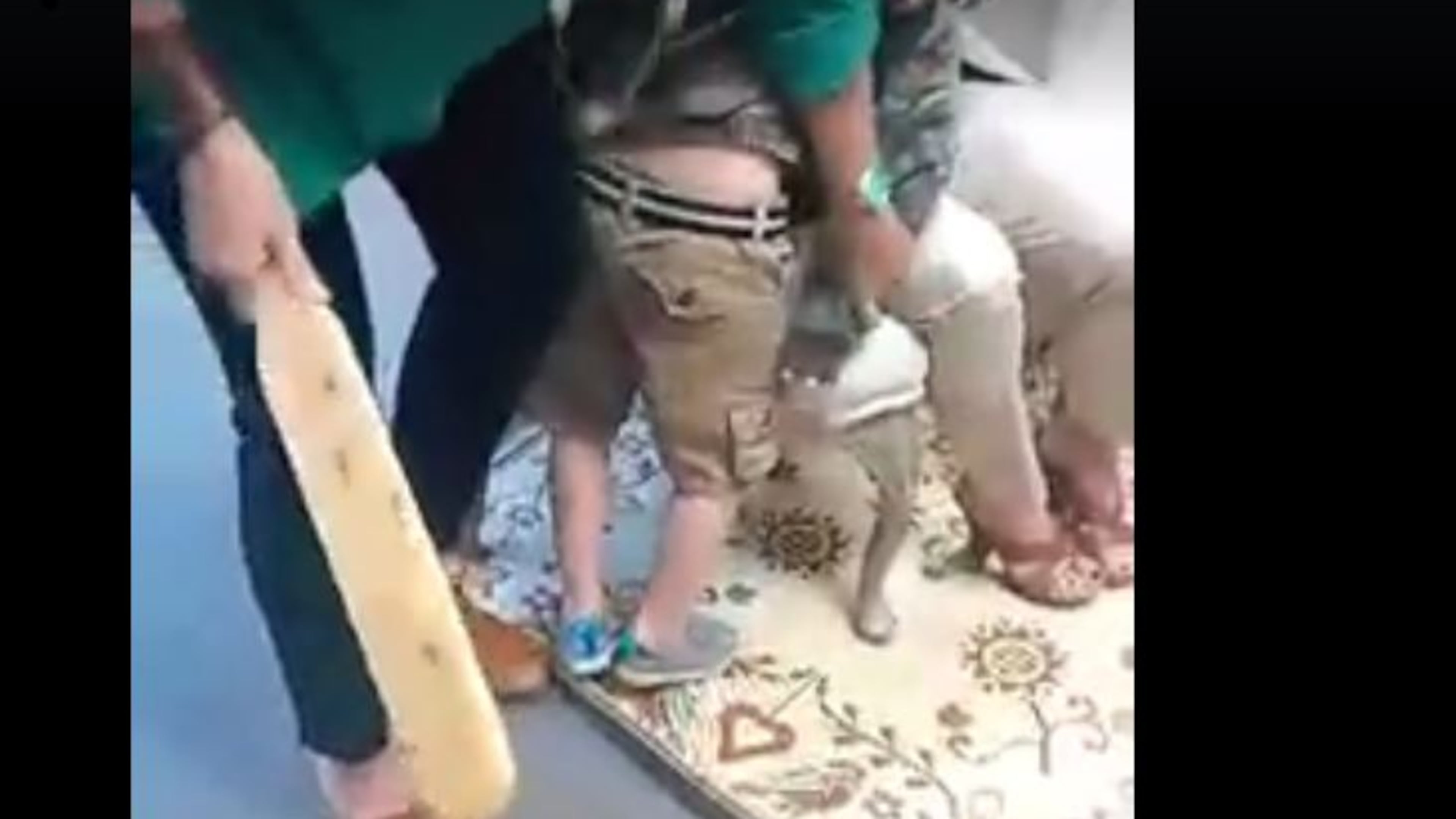 A screen shot from a video posted on Facebook, where Jasper County Primary School Principal Pam Edge and the assistant principal prepare to paddle a 5-year-old. (Facebook/Shana Marie Perez)