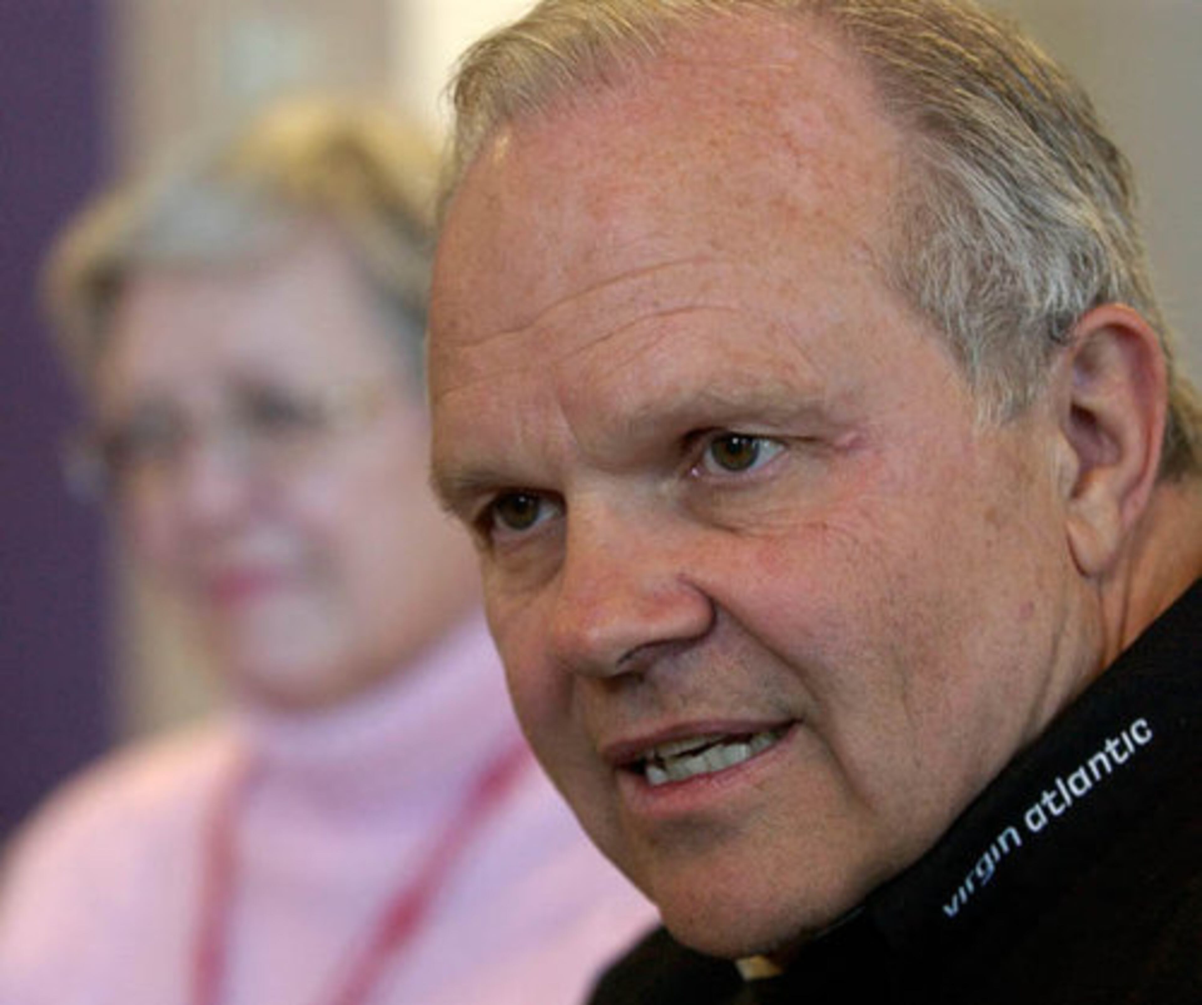 Steve Fossett, left, talks while his wife Peggy looks on after one of his record setting attempts was delayed by high crosswinds.