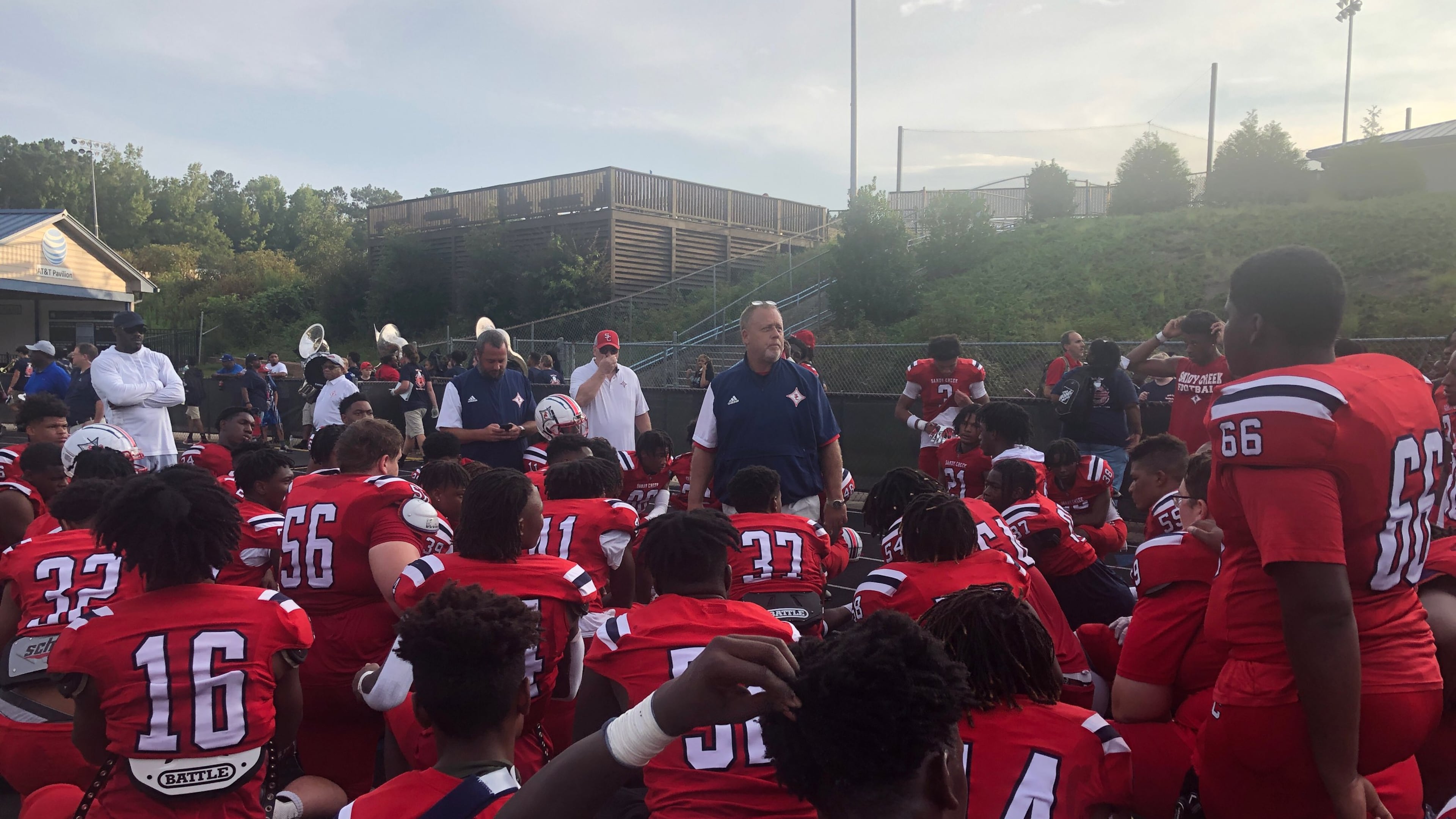 Sandy Creek coach Brett Garvin speaks to his team after the 38-27 win over Newnan in the 2022 Fayetta-Coweta Kickoff Classic.