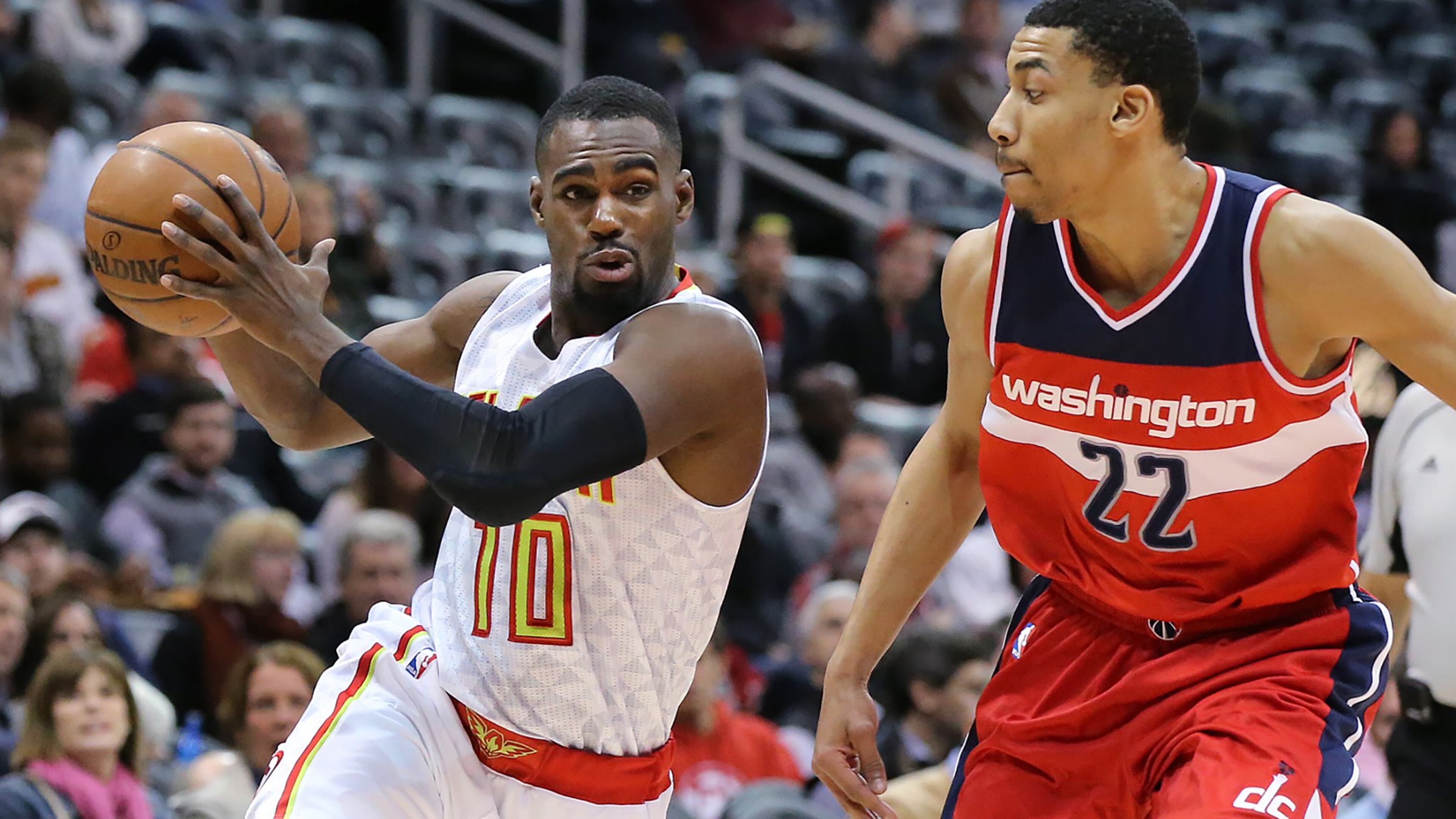 Hawks guard Tim Hardaway, Jr., drives against Wizards Otto Porter in a basketball game on Monday, March 21, 2016, in Atlanta. Curtis Compton / ccompton@ajc.com