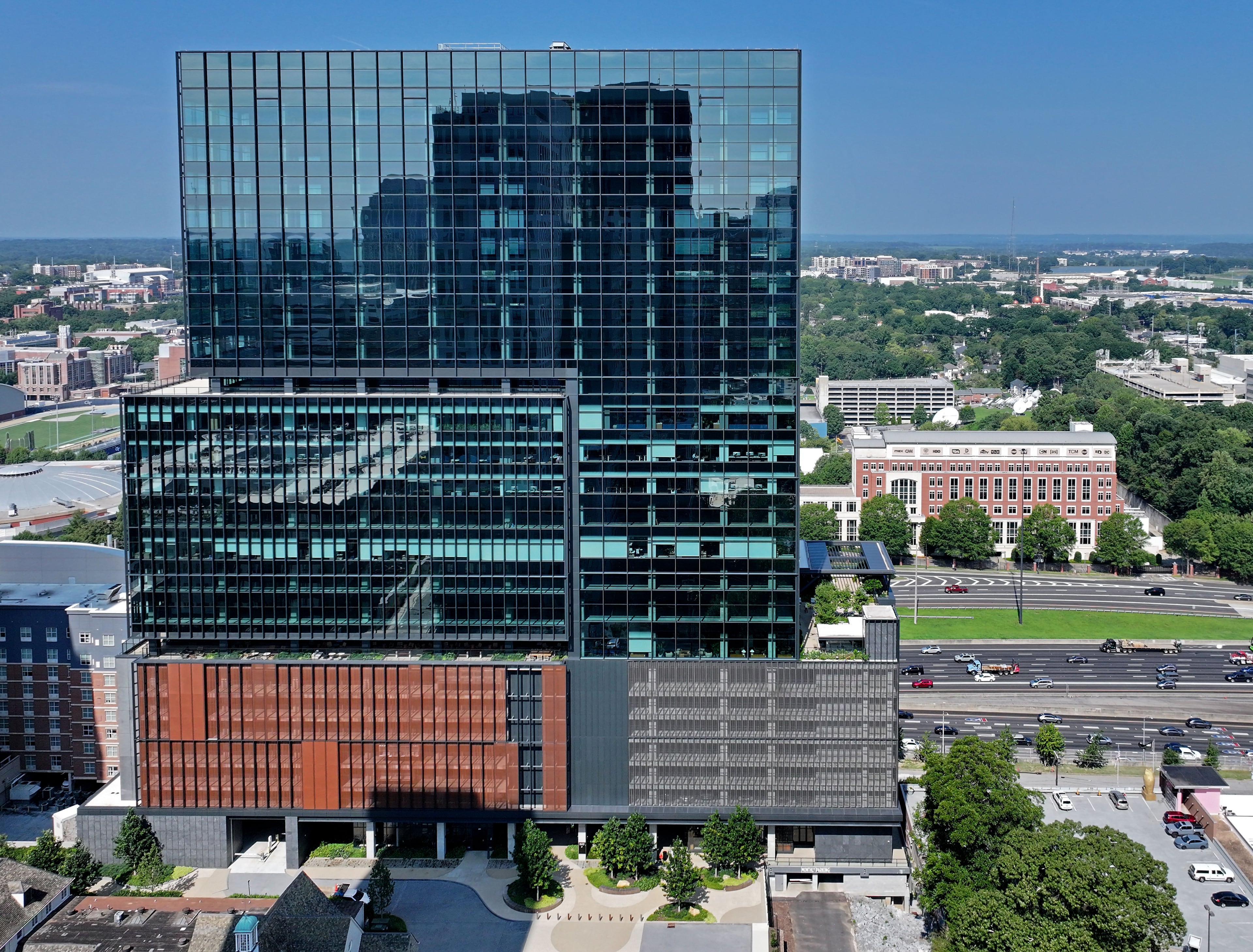 Aerial photograph shows Ten Twenty Spring office tower at 1020 Spring St. NW on Friday, July 31, 2026, in Atlanta. Pinnacle will occupy 165,000 square feet of premier office space at Ten Twenty Spring and bring an estimated 400 team members to the building. (Hyosub Shin/AJC)