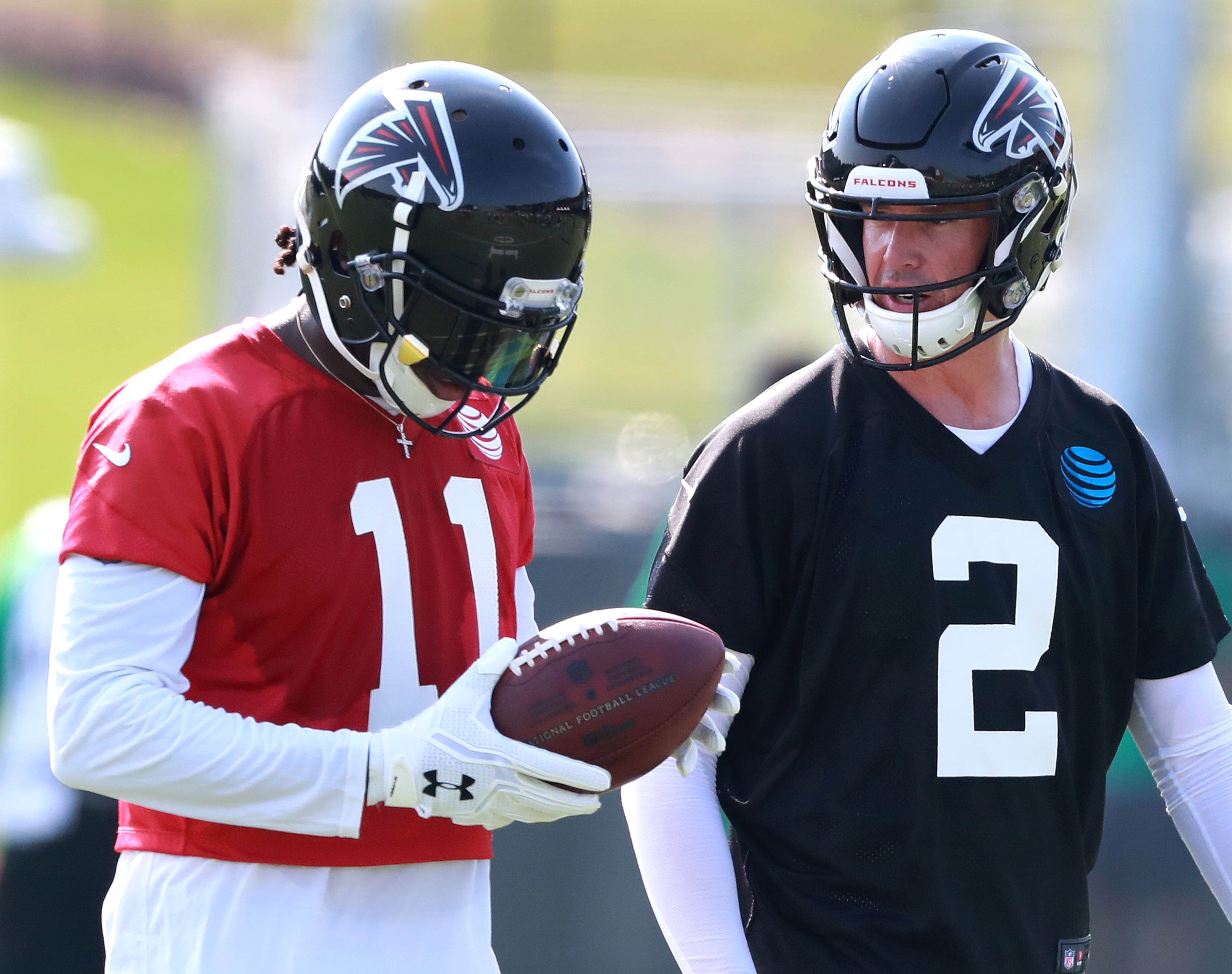 Matt Ryan and Julio Jones confer after a play. Curtis Compton/ccompton@ajc.com
