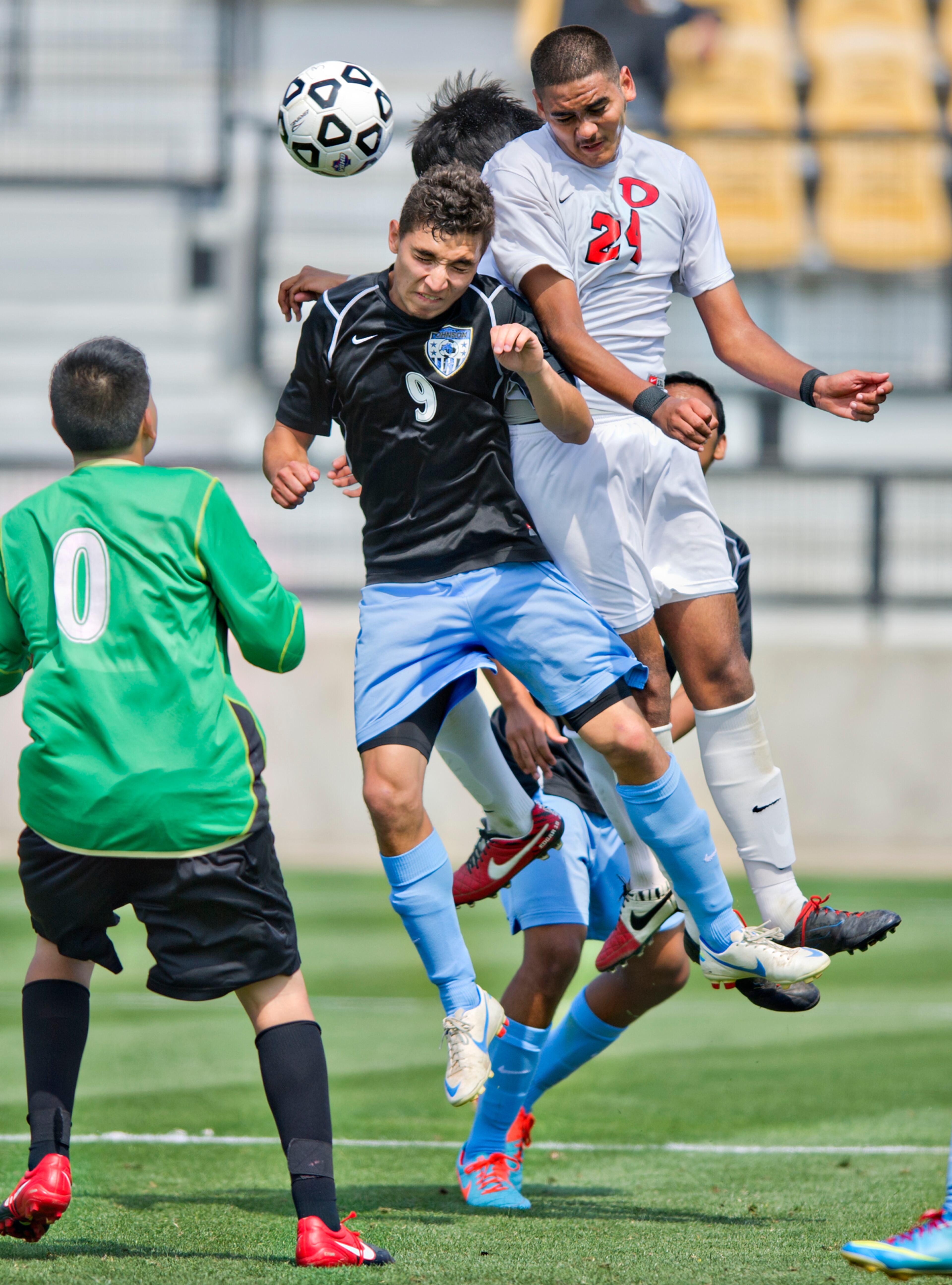 Dalton's Jose Gardea (24) competes for the ball against Johnson's Luis Hernandez (9) during the Class AAAA championship soccer game at Kennesaw State University on Saturday, May 17, 2014.