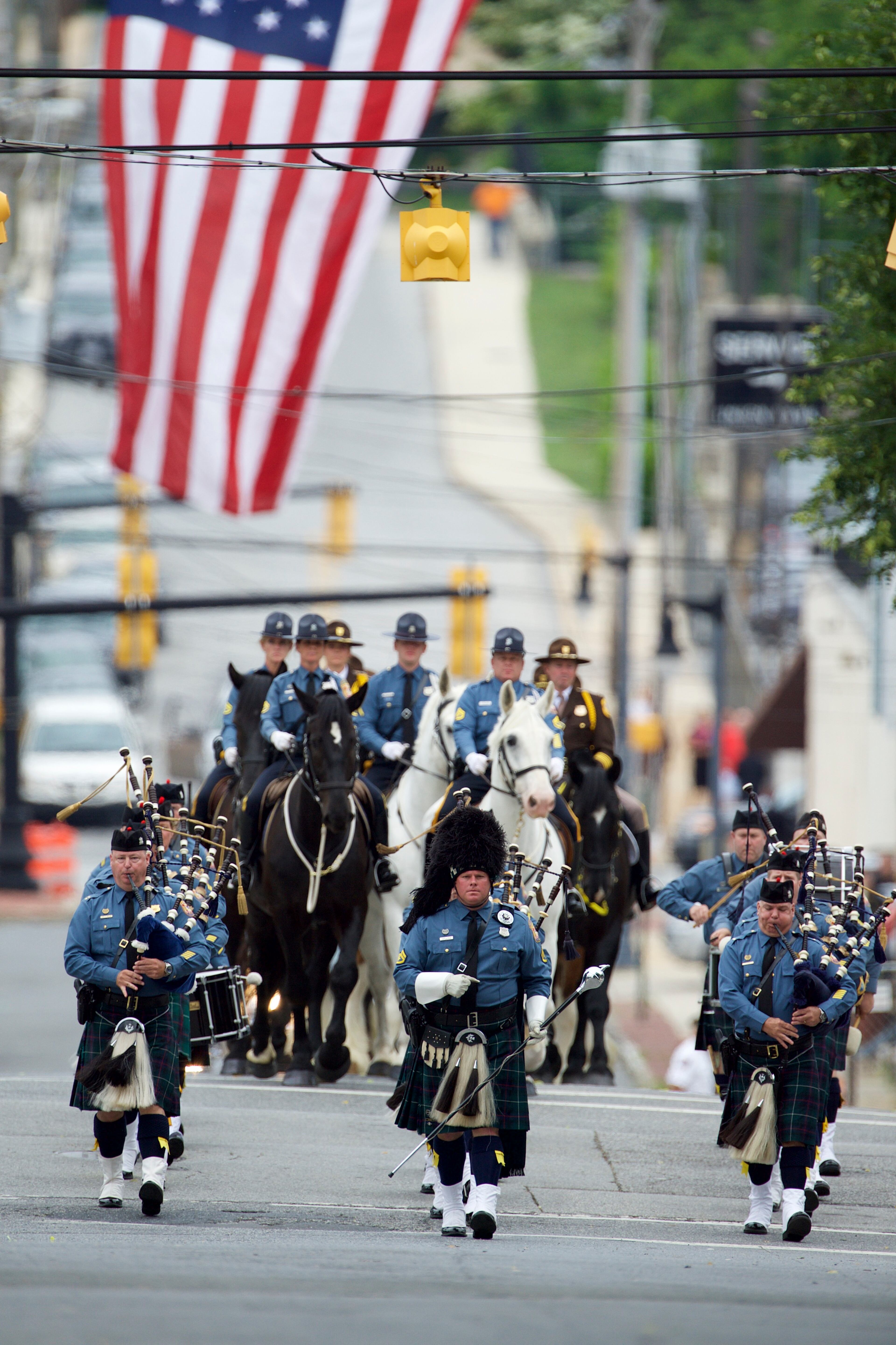 WILMINGTON, DE - JUNE 6: A funeral procession marches towards a mass of Christian burial at St. Anthony of Padua Church for former Delaware Attorney General Beau Biden on June 6, 2015 in Wilmington, Delaware. U.S. President Barack Obama is expected to deliver a eulogy for the son of Vice President Joe Biden after he died at 46 following a two-year battle with brain cancer. (Photo by Mark Makela/Getty Images)