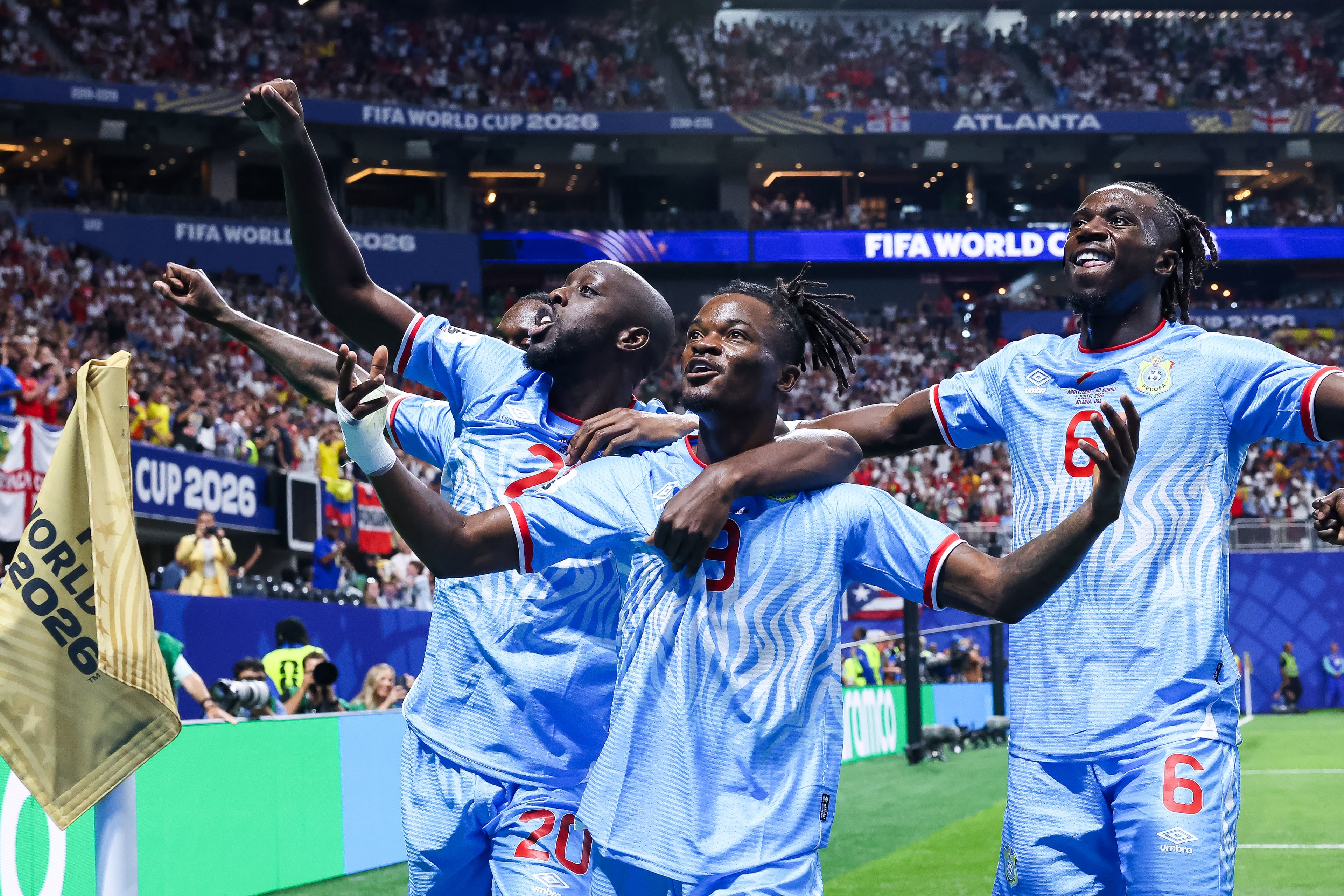 Congo forward Brian Cipenga (center) celebrates with teammates Yoane Wissa (left) and Ngal'ayel Mukau (right) after scoring a goal against England during the first half of a FIFA World Cup round of 32 match at Atlanta Stadium (Mercedes-Benz Stadium) on Wednesday, July 1, 2026, in Atlanta. (Jason Getz/AJC)