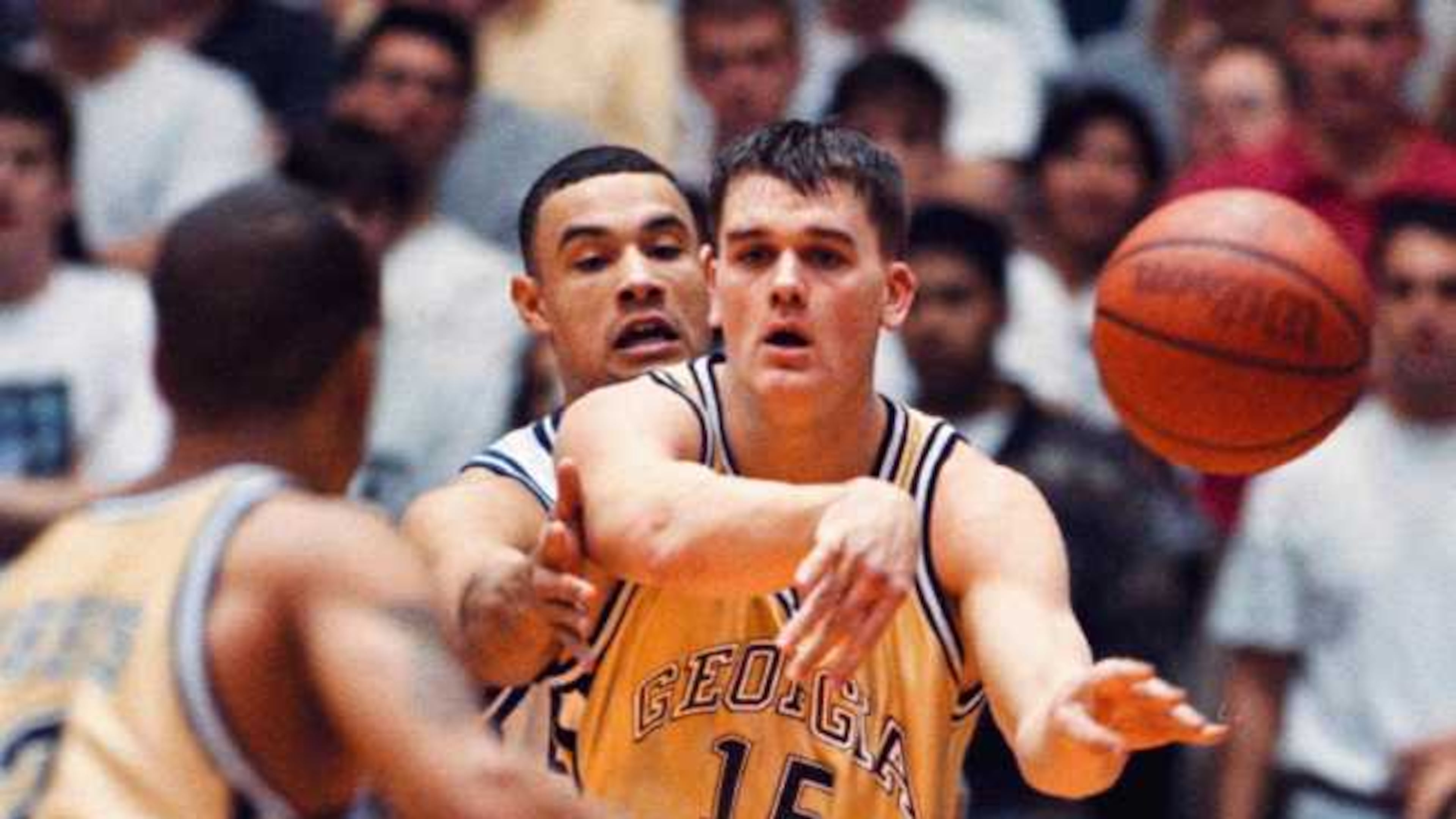 Georgia Tech’s Matt Harpring (15) dishes off the ball when he is met by Duke’s Trajan Langdon (21) during game action, Sunday, Feb. 2, 1997 at Cameron Indoor Stadium in Durham, N.C. Duke defeated Georgia Tech 70-61. (AP Photo/ Karl DeBlaker)