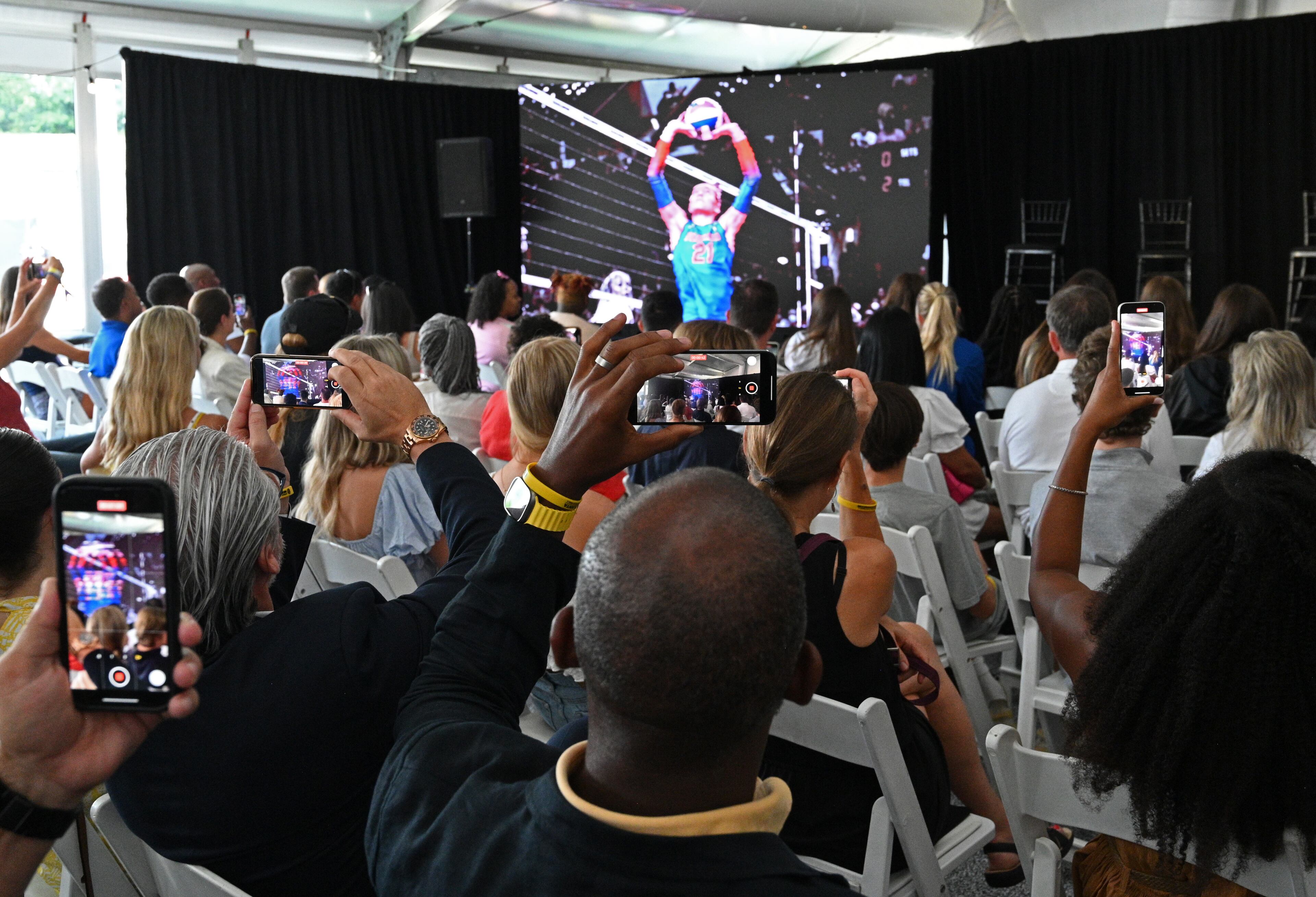 Guests take photos and videos of the historic day for valleyball in Atlanta. (Hyosub Shin / Hyosub.Shin@ajc.com)