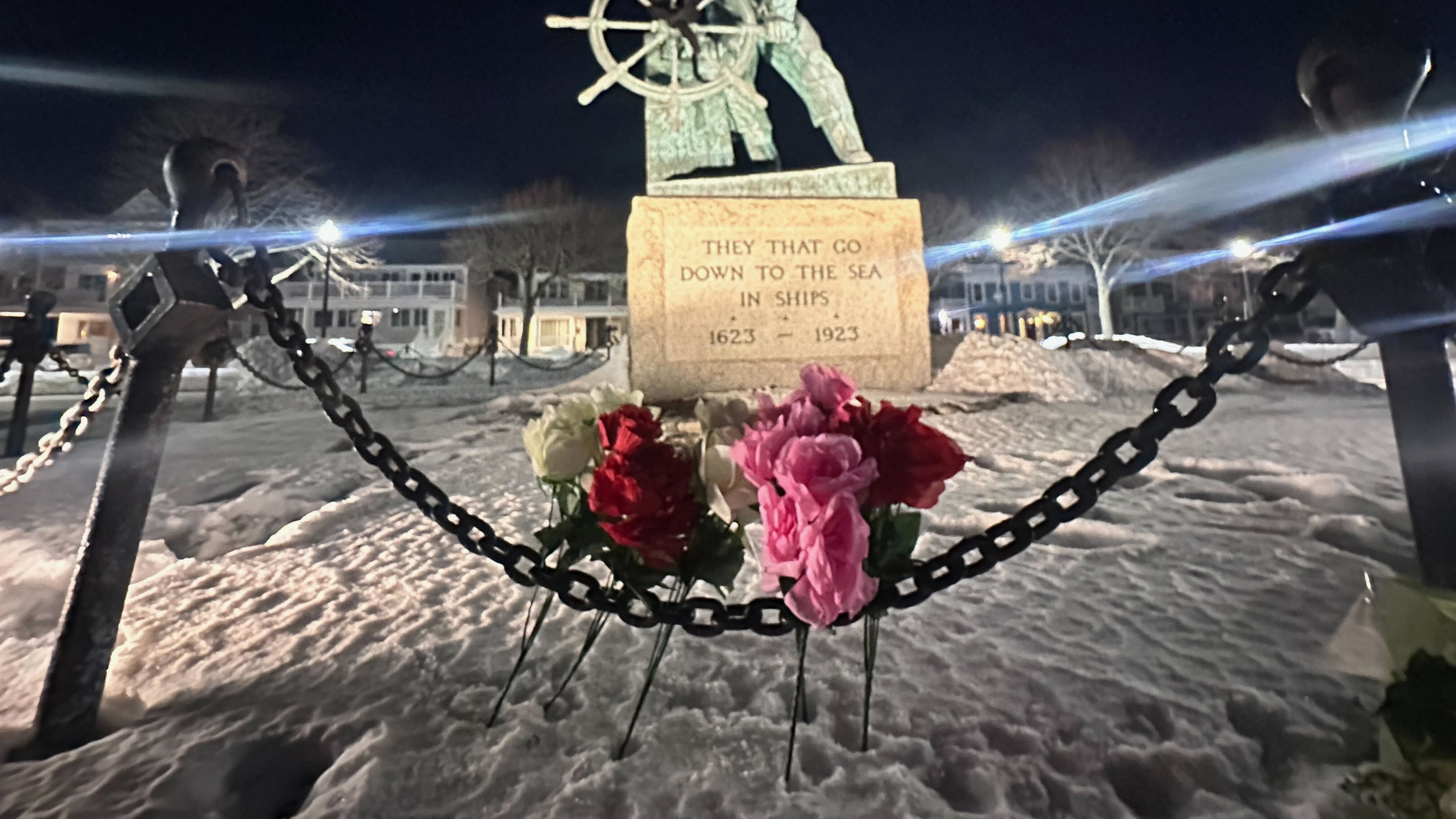Flowers are seen placed at the Gloucester Fisherman's Memorial in Gloucester, Mass., after a fishing boat from port city went missing off the coast of Massachusetts with multiple people on board, Friday, Jan. 30, 2026. (AP Photo/Robert F. Bukaty)