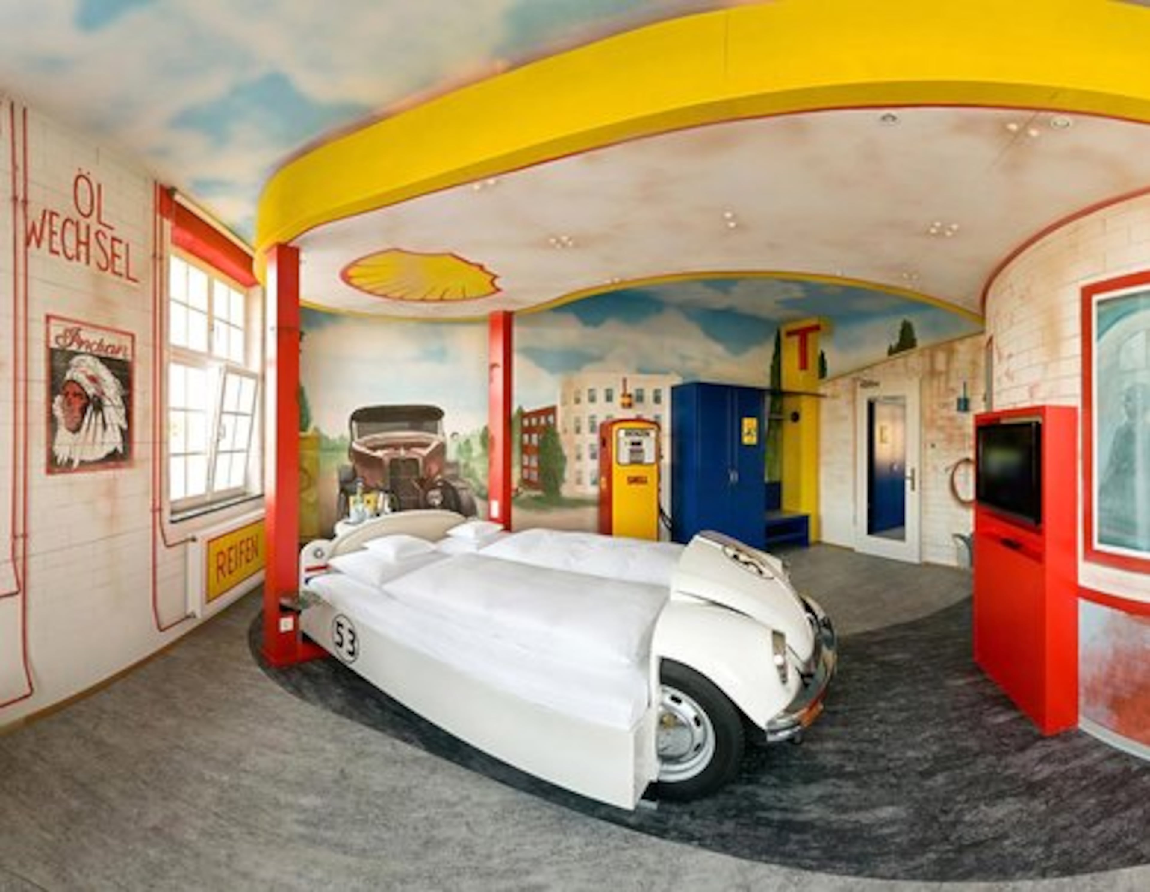 If you need to service your tired body after a day of sightseeing, this gas station-themed room may be just what you need. The chair designed as a trunk of a car is a great place to unwind.