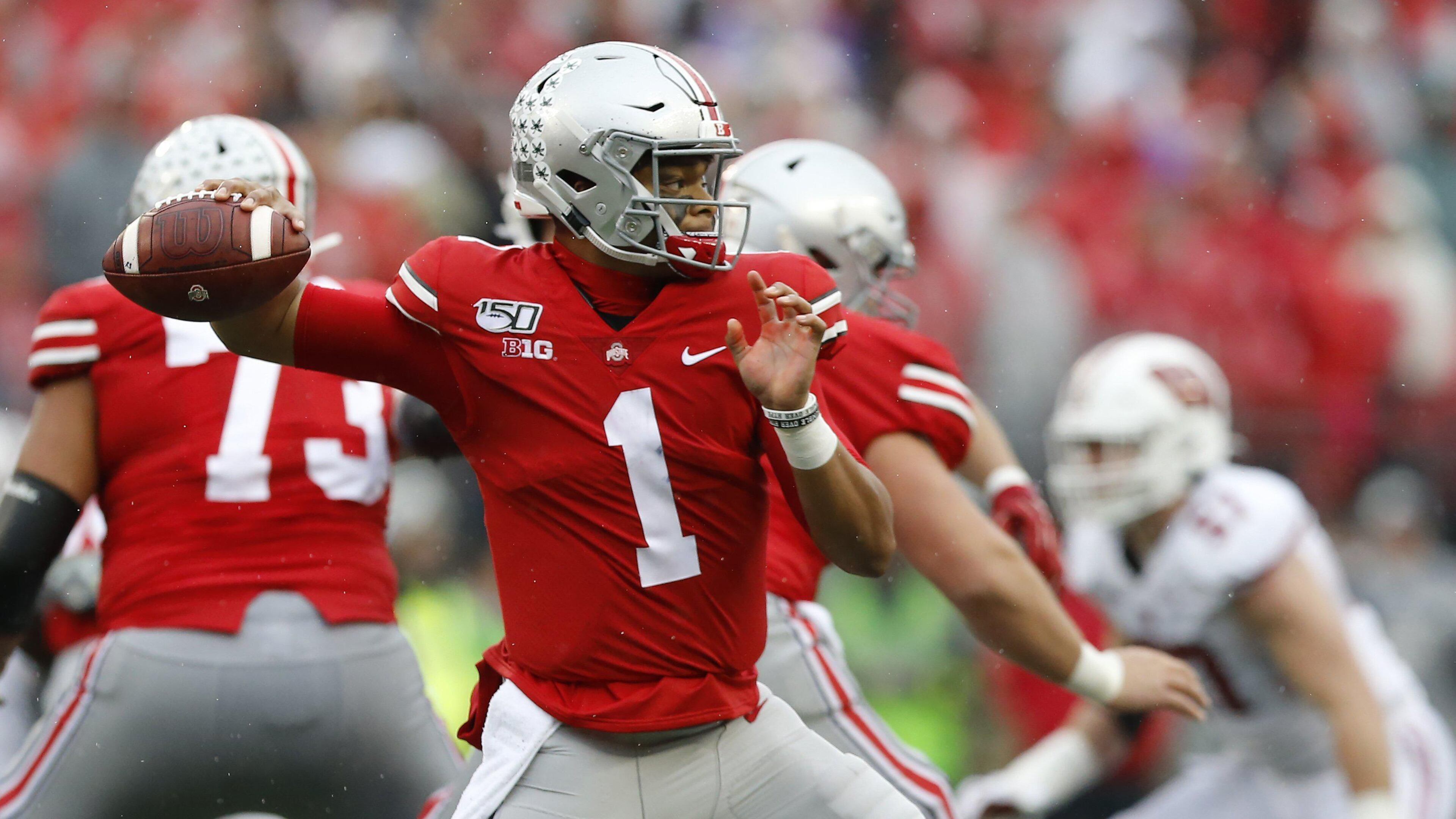 Justin Fields, Ohio State's quarterback, is expected to be a high draft pick. (Adam Cairns/Columbus Dispatch/TNS)