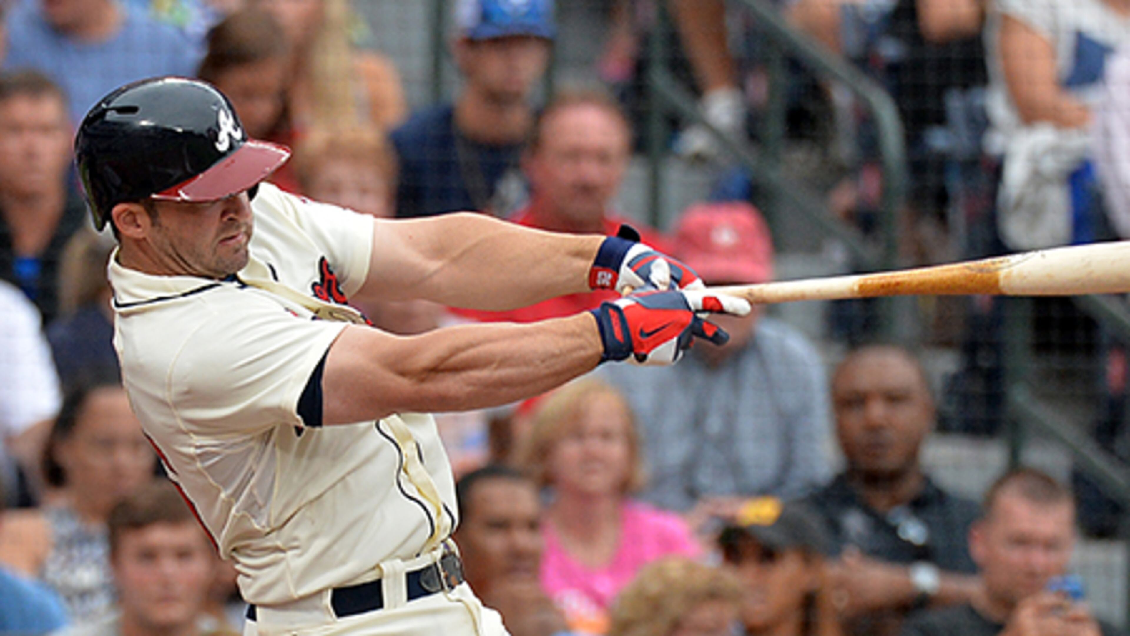 July 13, 2013 Atlanta - Atlanta Braves Dan Uggla (26) hits one run home run in the 7th inning against the Cincinnati Reds at Turner Field in Atlanta on Saturday, July 13, 2013. HYOSUB SHIN / HSHIN@AJC.COM