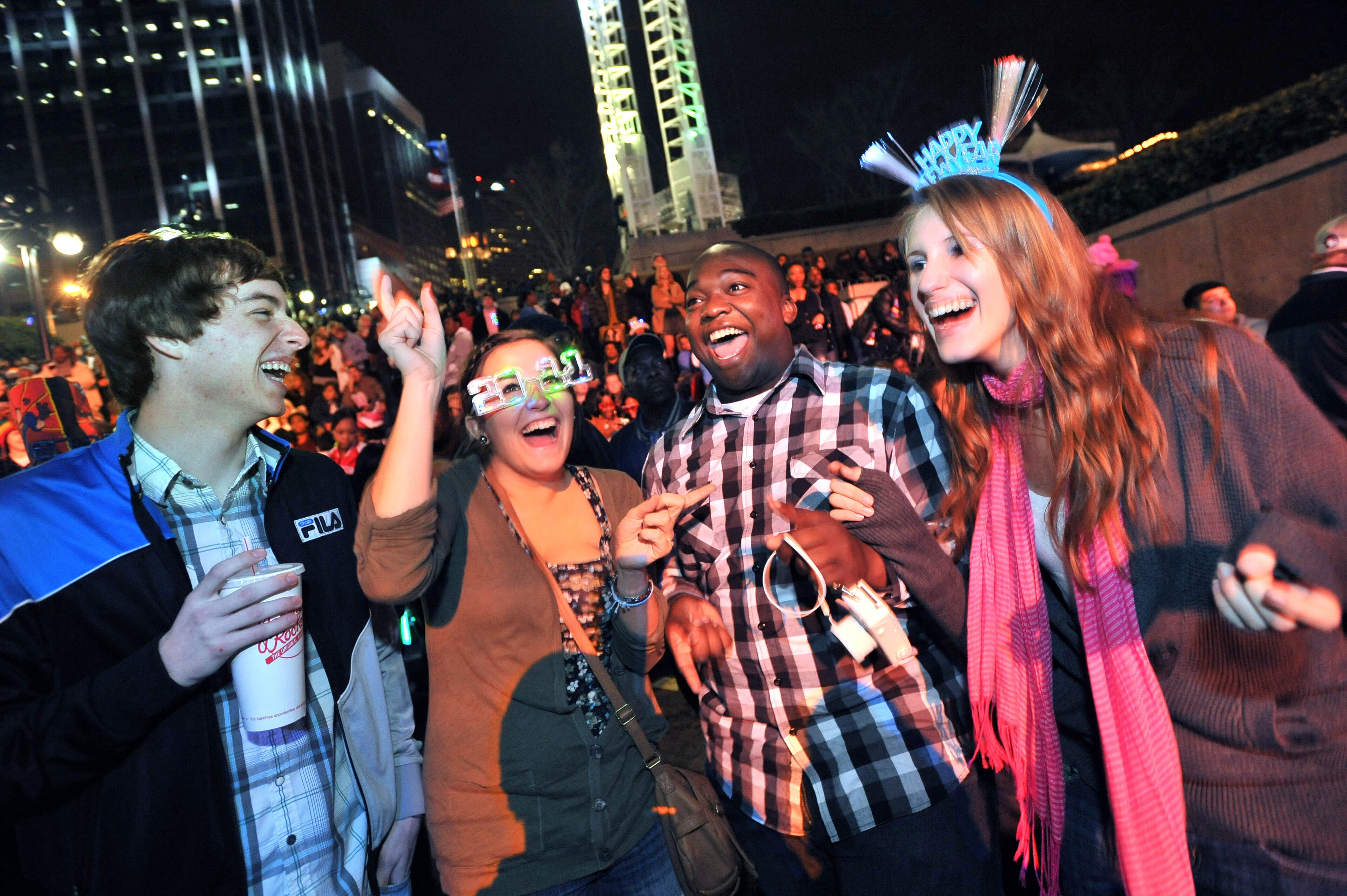 101231 Atlanta : Shawn Horan, 18, (from left) Emily Metz, 18, Terrence Glaspy, 17, an Julie Weedon, 18, all of Hiram, come to the New Year's Eve Peach Drop to celebrate their new year eve at Underground Atlanta on Friday, Dec. 31, 2010. Hyosub Shin, hshin@ajc.com