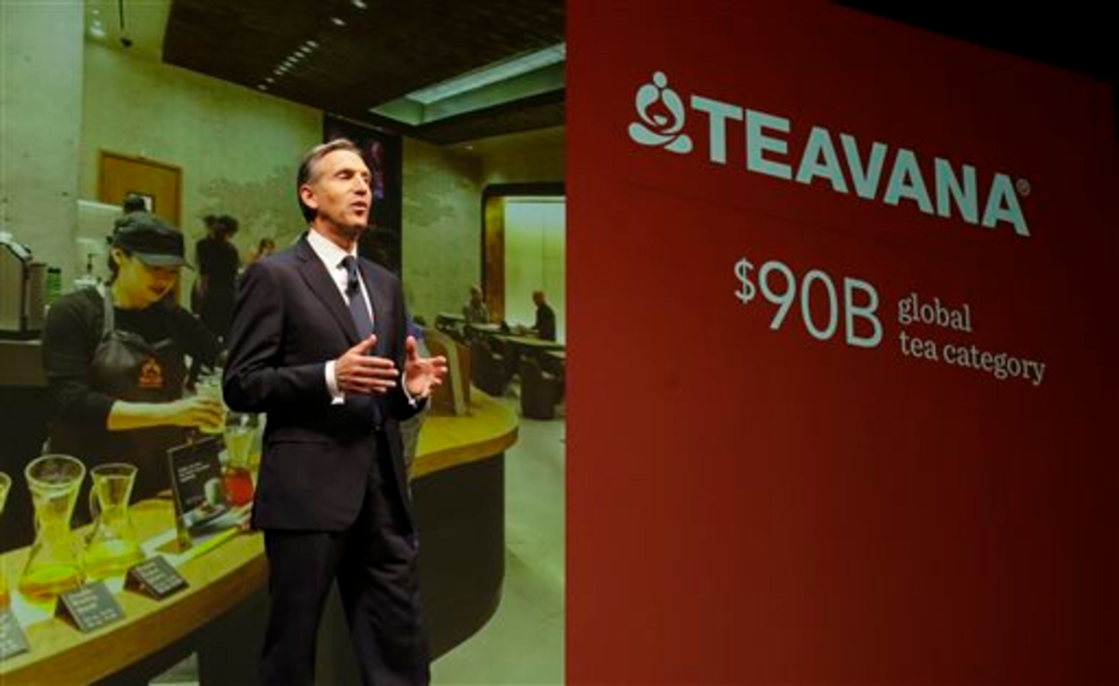 Howard Schultz, chairman and CEO of Starbucks Coffee Company, talks about Starbucks' Teavana tea products, Wednesday, March 19, 2014, at the company's annual shareholders meeting in Seattle. Schultz says growth in the tea market is a key part of Starbucks' strategy for the years ahead. (AP Photo/Ted S. Warren)