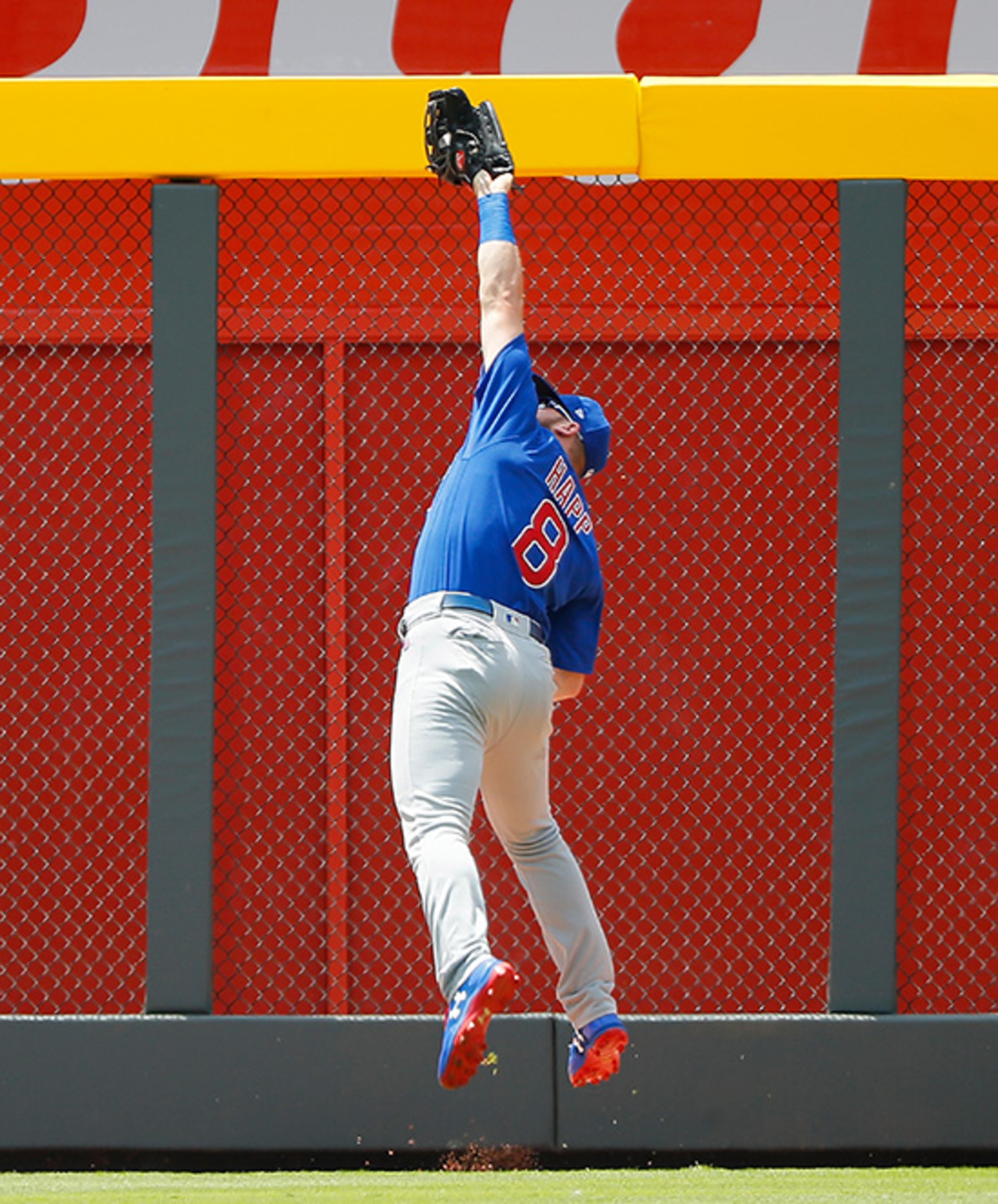 ATLANTA, GA - JULY 19: Ian Happ #8 of the Chicago Cubs leaps to catch a fly out hit by Danny Santana #23 of the Atlanta Braves to end the second inning at SunTrust Park on July 19, 2017 in Atlanta, Georgia. (Photo by Kevin C. Cox/Getty Images)