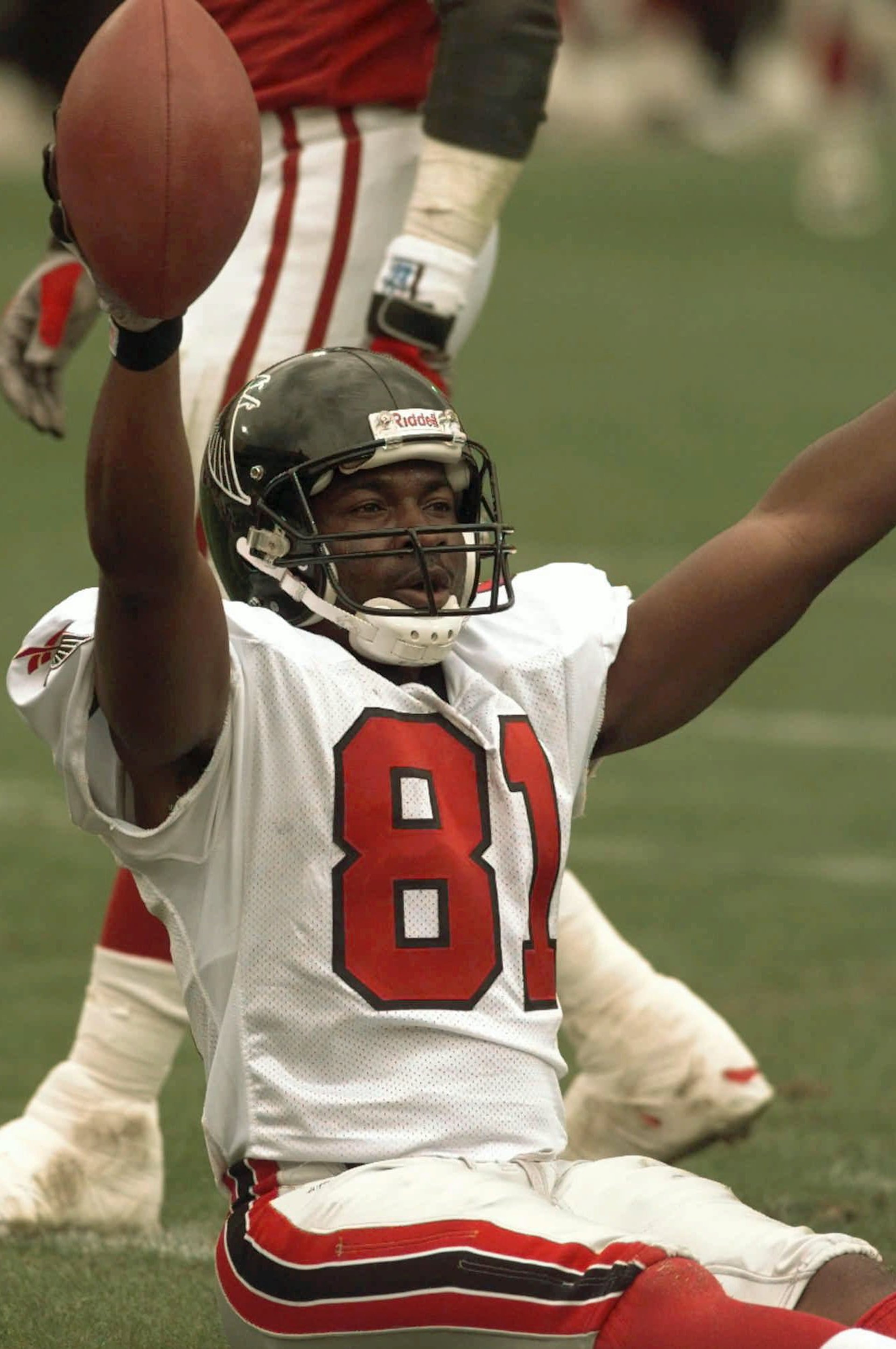 Atlanta Falcons Terance Mathis (81) celebrates after scoring a touchdown in their NFL game against the Arizona Cardinals during the first quarter of their game Sunday, Dec. 21, 1997 in Tempe, Ariz. It was the second Falcons touchdown in the quarter. (AP Photo/Jeff Robbins)
