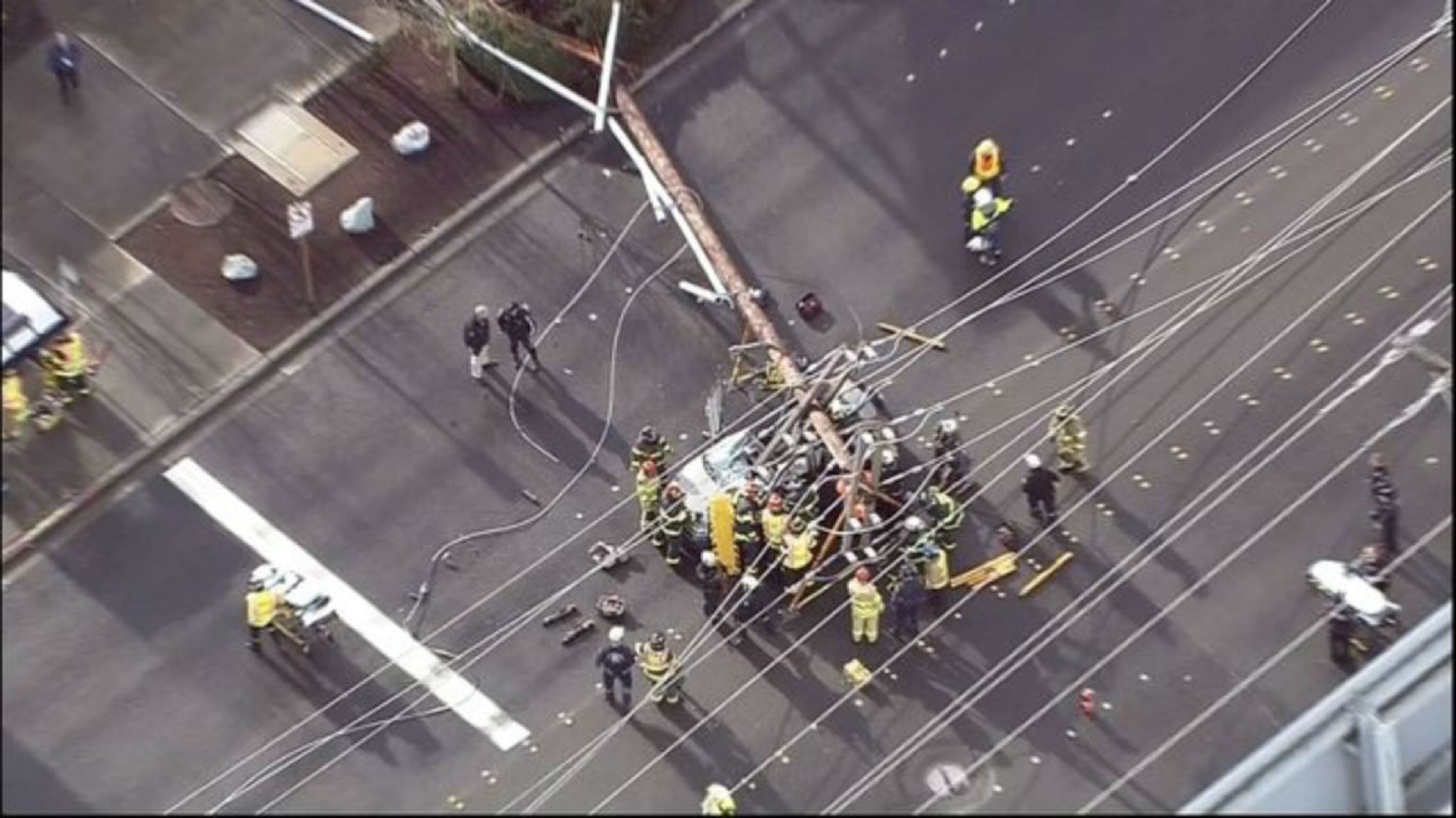 Two people were injured after a power pole crashed onto their vehicle. (Photo: KIRO7.com)
