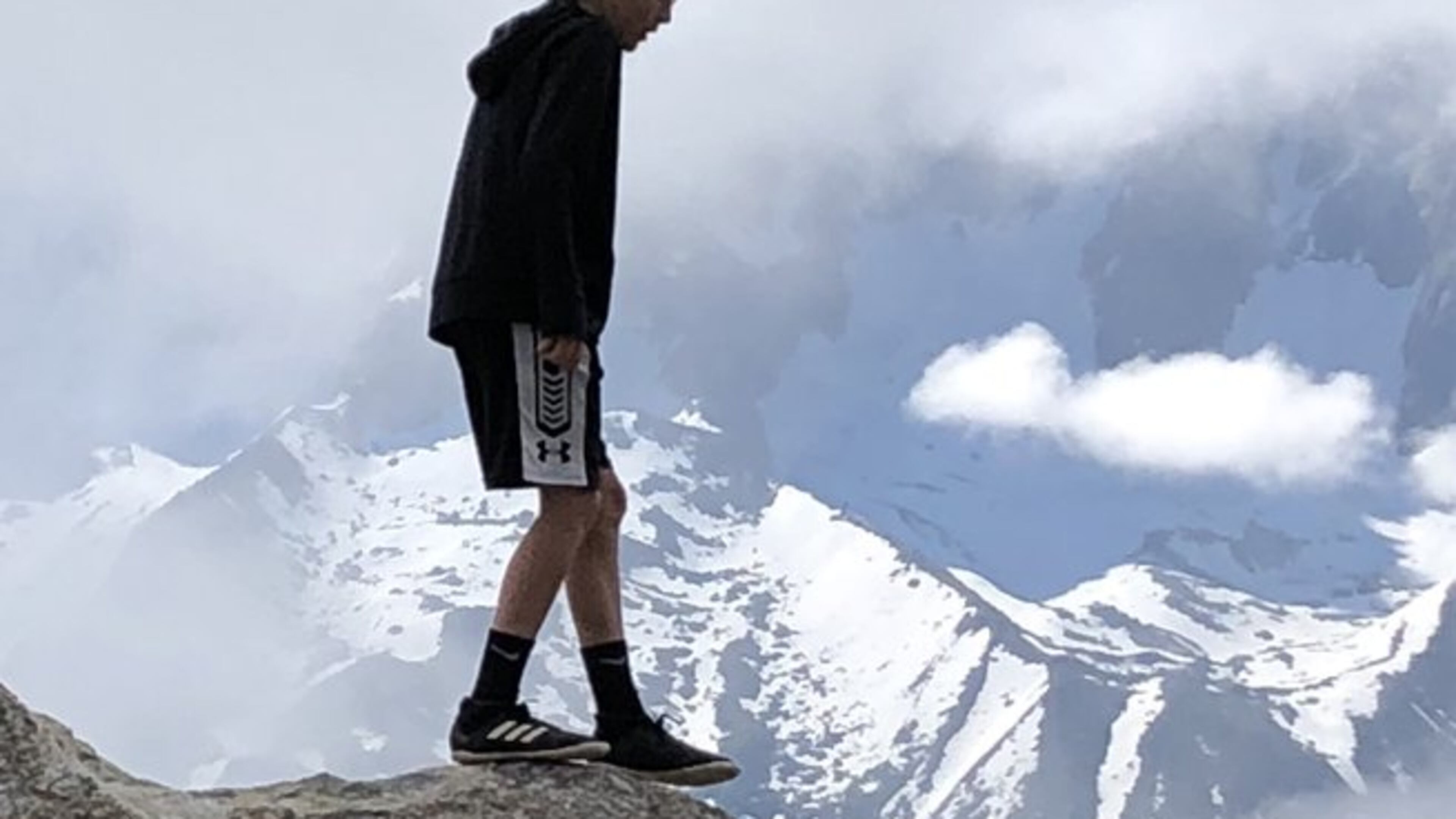 Susan Wietsma took this photo of her 11-year-old son outside of Chamonix France in the French Alps. The Mont Blanc is behind the clouds. According to Encyclopaedia Britannica, Mont Blanc is the highest peak (15,771 feet) in Europe. Located in the Alps, it lies along the French-Italian border and reaches into Switzerland. It extends southwestward from Martigny, Switzerland, for about 25 miles and has a maximum width of 10 miles. The summit is in French territory. Surrounding the massif are the Graian Alps (south), the Chamonix Valley and Savoy Alps (west), the Pennine Alps (northeast), and the Valley of Courmayeur (east). Other principal peaks within the massif include Mont Blanc du Tacul, Mont Maudit, Aiguille (“Peak”) du Géant, Les Grandes Jorasses, Mont Dolent, and Aiguille du Midi.