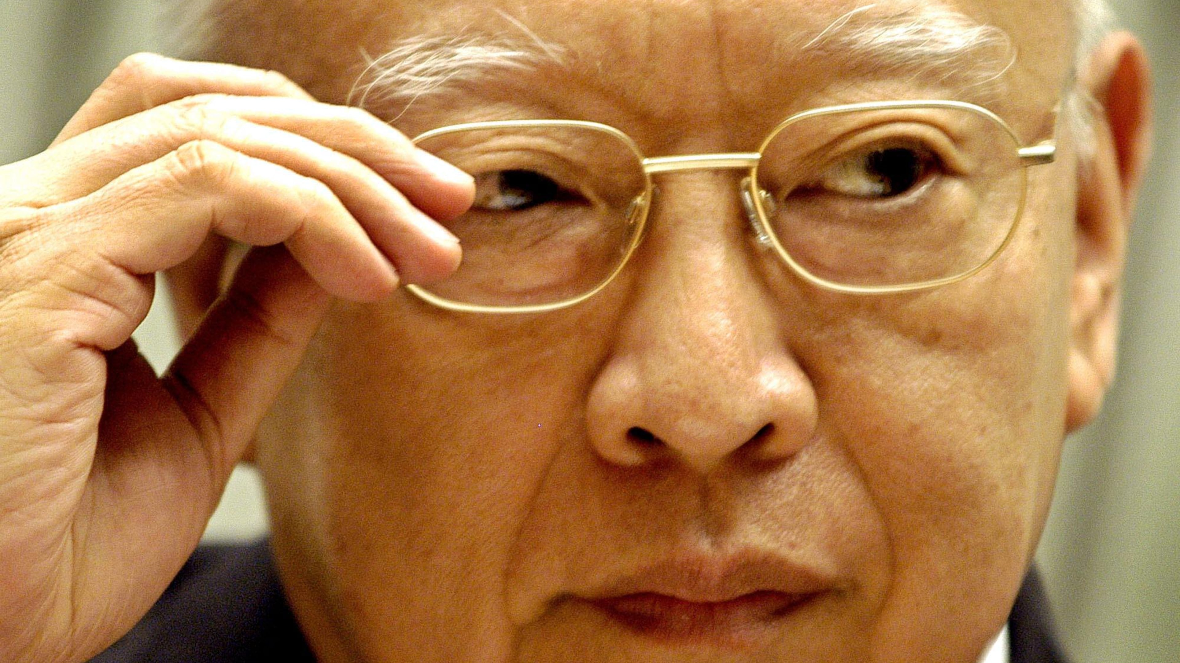 FILE - Hong Kong's Cheif Executive Tung Chee-hwa listens to reporter's question during a news conference at government headquarters in Hong Kong, April 26, 2004. (AP Photo/Vincent Yu, File)