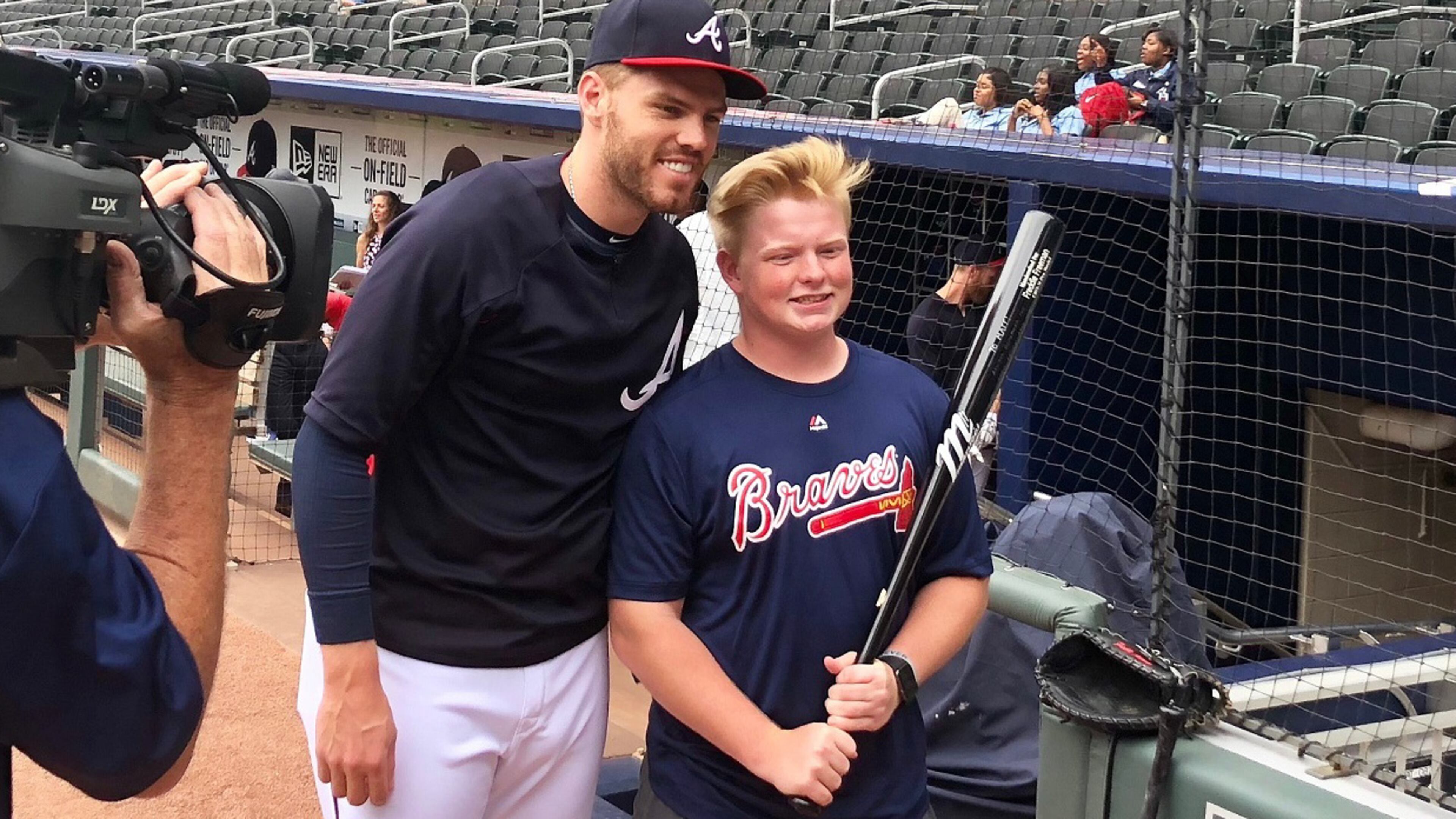 Braves first baseman Freddie Freeman met with Matt Klug before playing the Baltimore Orioles at SunTrust Park on Friday. (Photo by Tess DeMeyer/AJC)