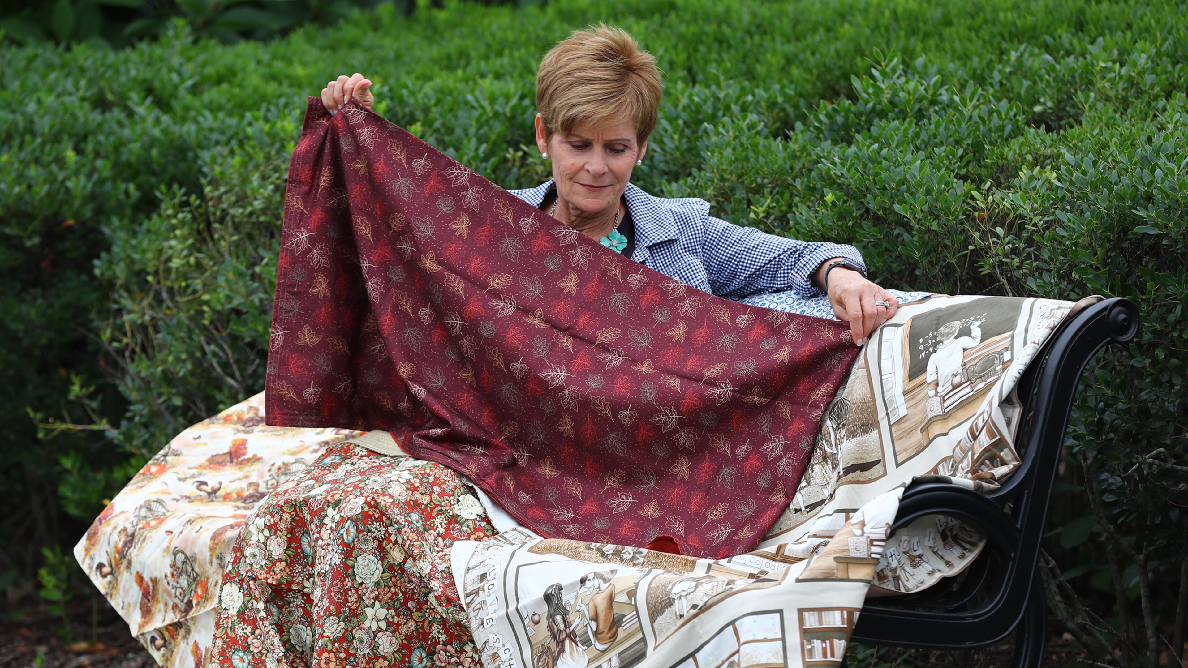 June 12, 2019 Suwanee: Rita Pincumbe, a compassionate Gwinnett Medical nurse known for making lovely comfort blankets shows off some of her work on Wednesday, June 12, 2019, in Suwanee. Pincumbe recently handed out her 100th comfort blanket. Curtis Compton/ccompton@ajc.com
