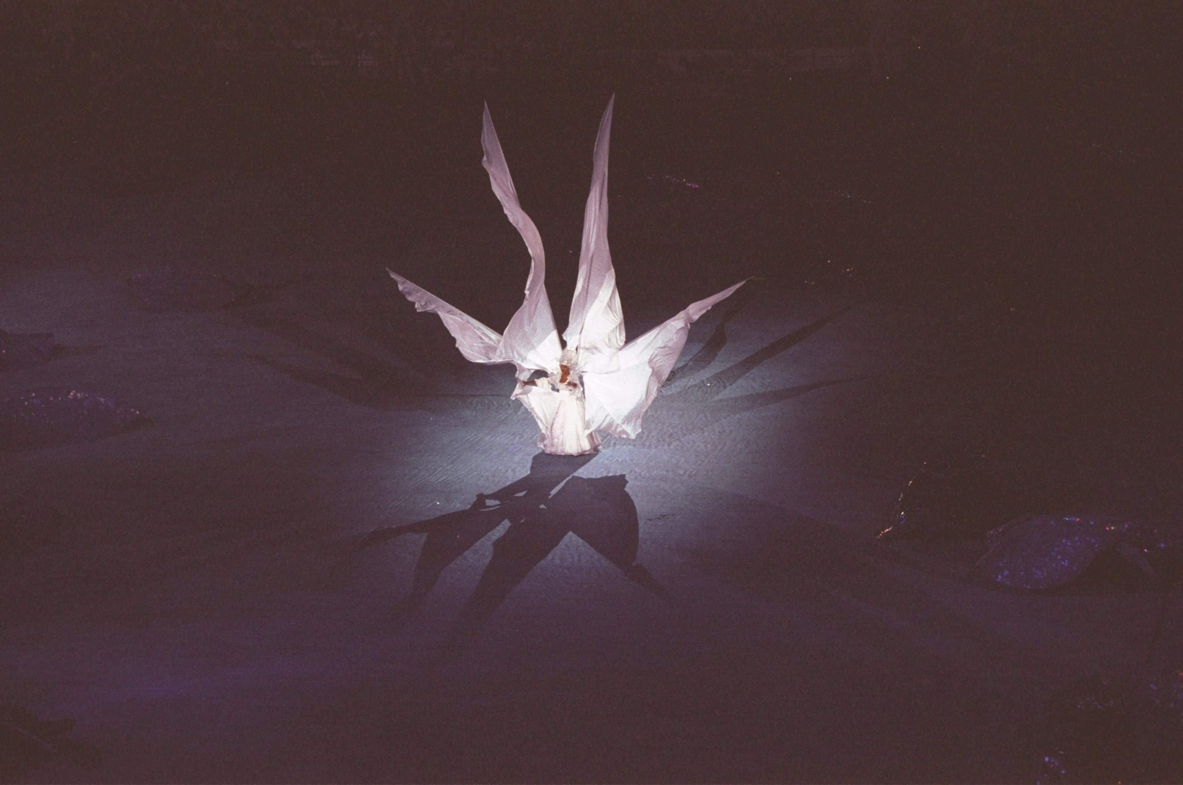 A spotlight picks out a lone dancer during the Opening Ceremony of the 1996 Olympic Games in Atlanta, Georgia.