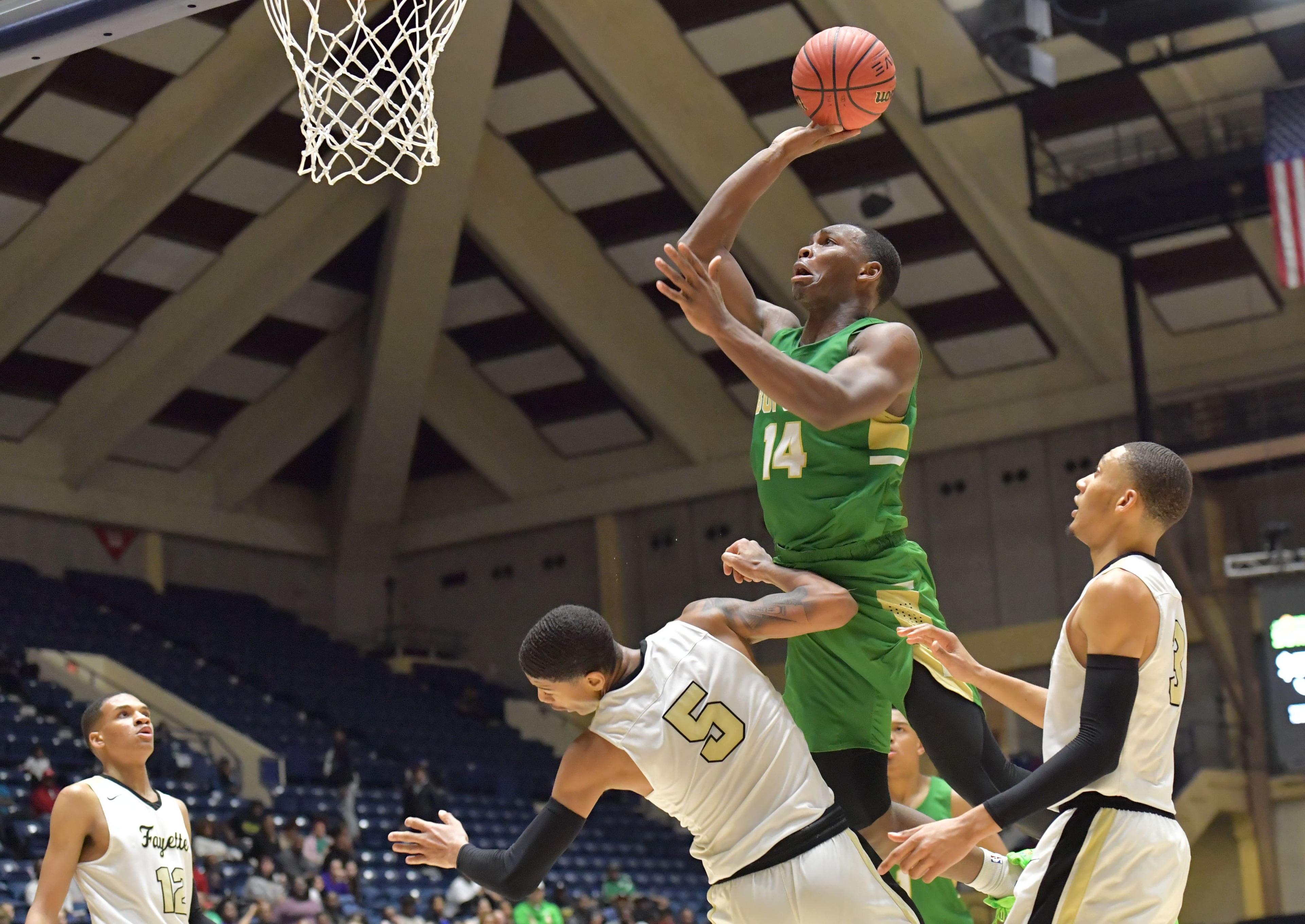 March 8, 2019 Macon - Buford Marcus Watson (14) shoots over Fayette County Terrell Bradley (5) in GHSA State Basketball Championship game at the Macon Centreplex in Macon on Friday, March 8, 2019. Buford won 76-69 over the Fayette County. HYOSUB SHIN / HSHIN@AJC.COM