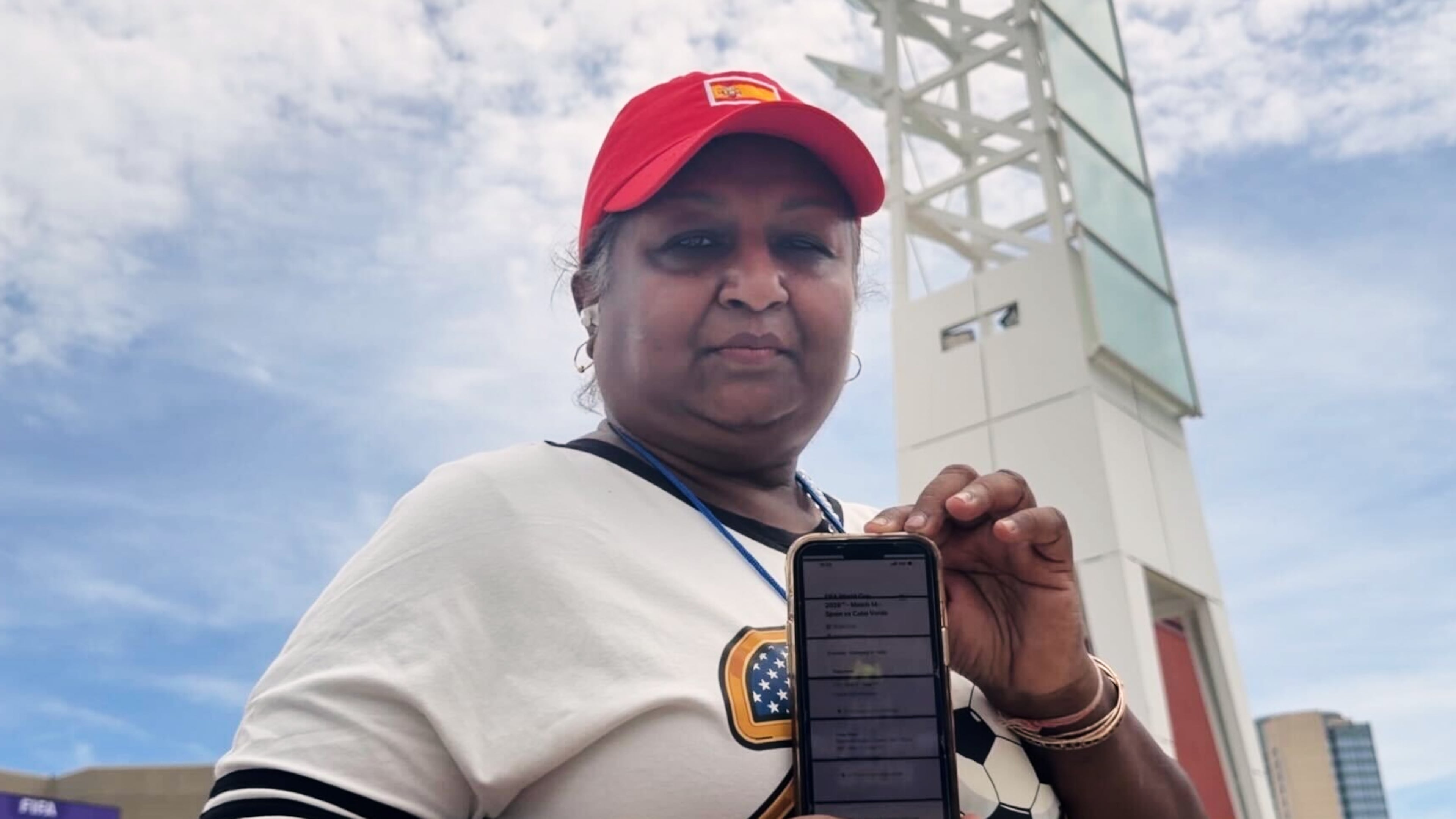 Bina Ramroop holds proof of the ticket she bought through StubHub for the World Cup Group H soccer match between Spain and Cape Verde in Atlanta on Monday, June 15, 2026. (AP Photo/Emilie Megnien)