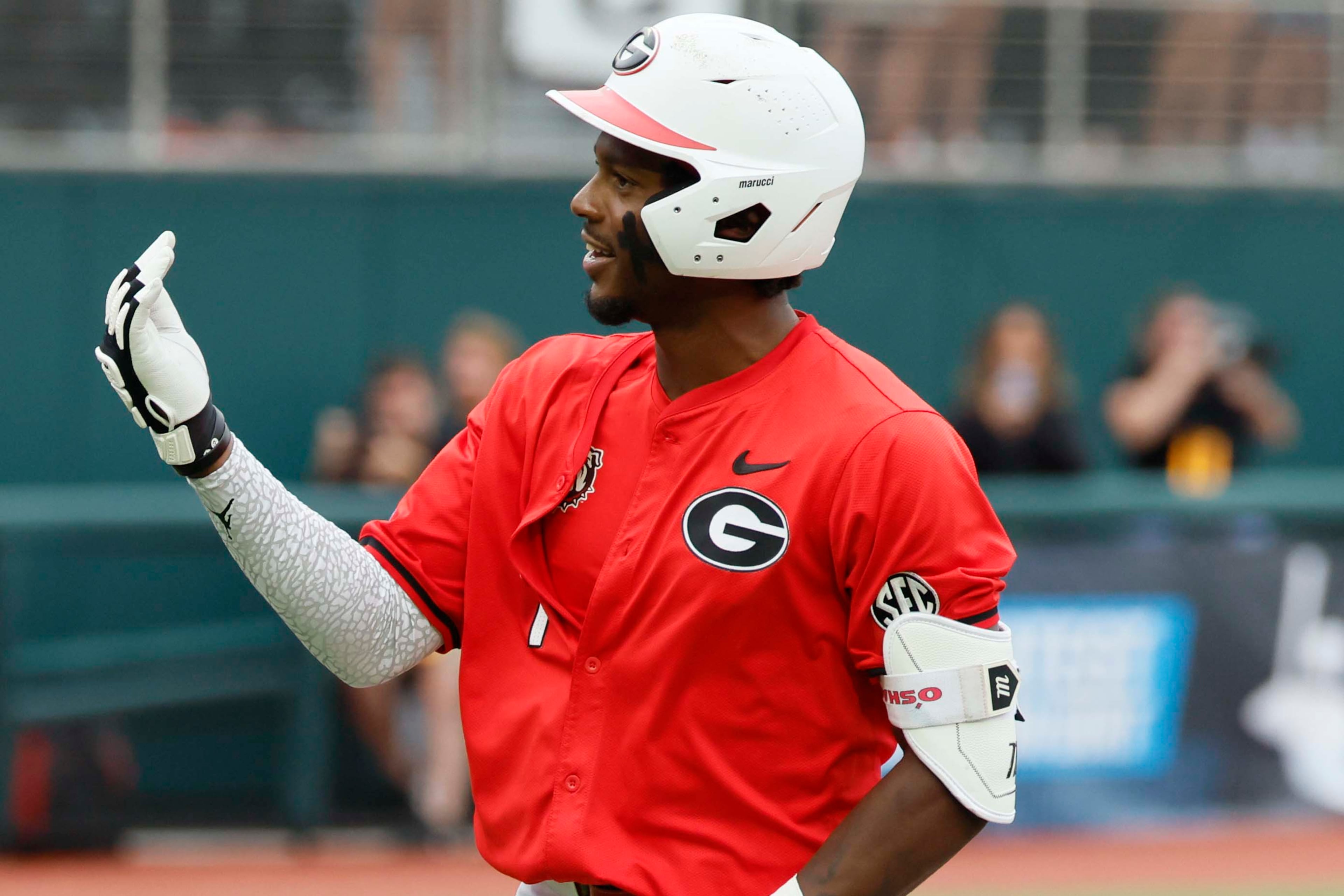 Georgia Bulldogs infielder Tre Phelps (1) gestures to the Liberty dugout after his two-run home run during the sixth inning of their NCAA Regional final game at Foley Field on Sunday, May 31, 2026, in Athens. Tre Phelps was later ejected for excessive celebration. (Miguel Martinez/AJC)