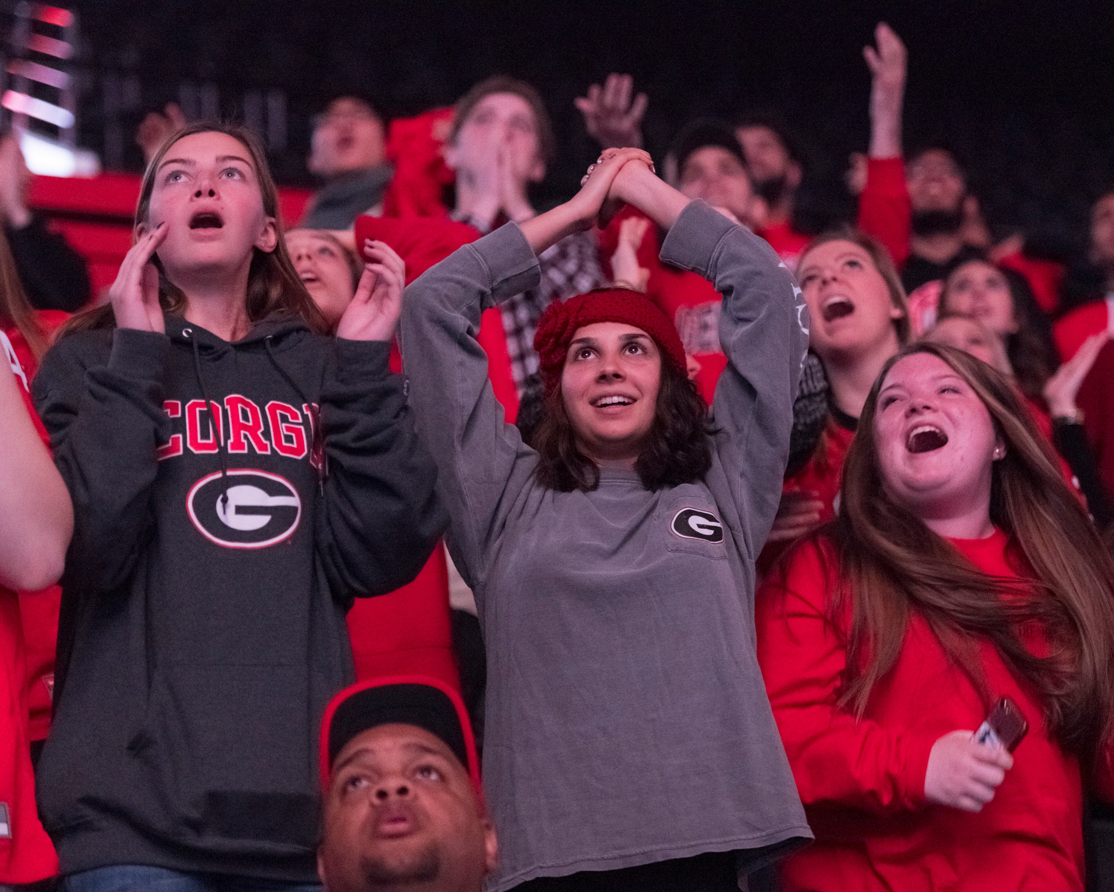 January 8, 2018, Athens - Students cheer while watching the NCAA National Championship game between UGA and Alabama at Stegeman Coliseum in Athens, Georgia, on Monday, January 8, 2018. DAVID BARNES / SPECIAL