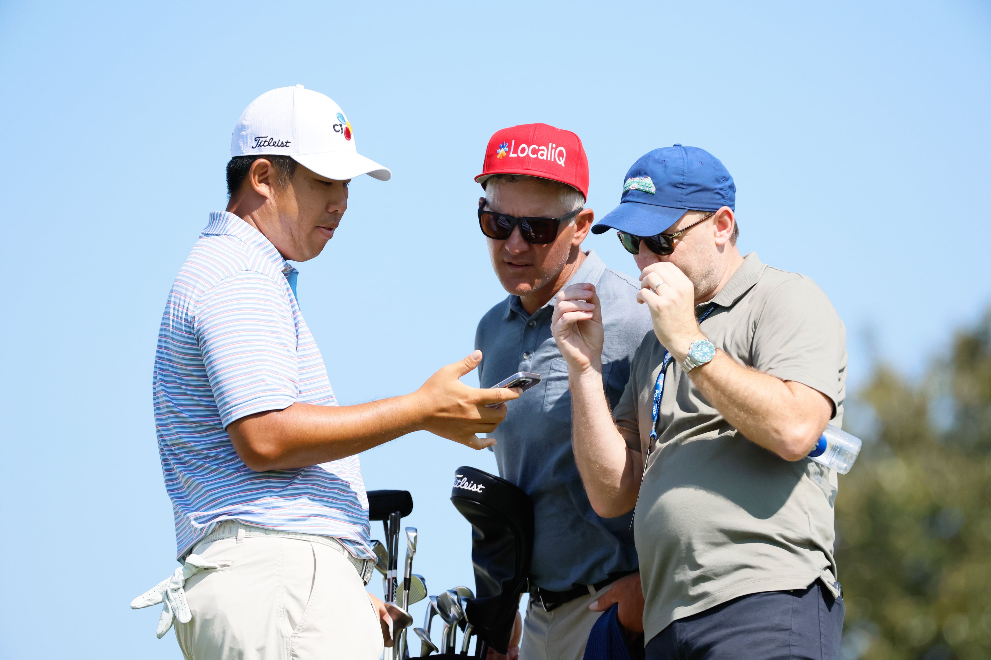 Sungjae Im speaks with his staff before moving to the fourth hole during a practice round for the 2024 Tour Championship at East Lake Golf Club on Tuesday, Aug. 27, 2024, in Atlanta.
(Miguel Martinez / AJC)