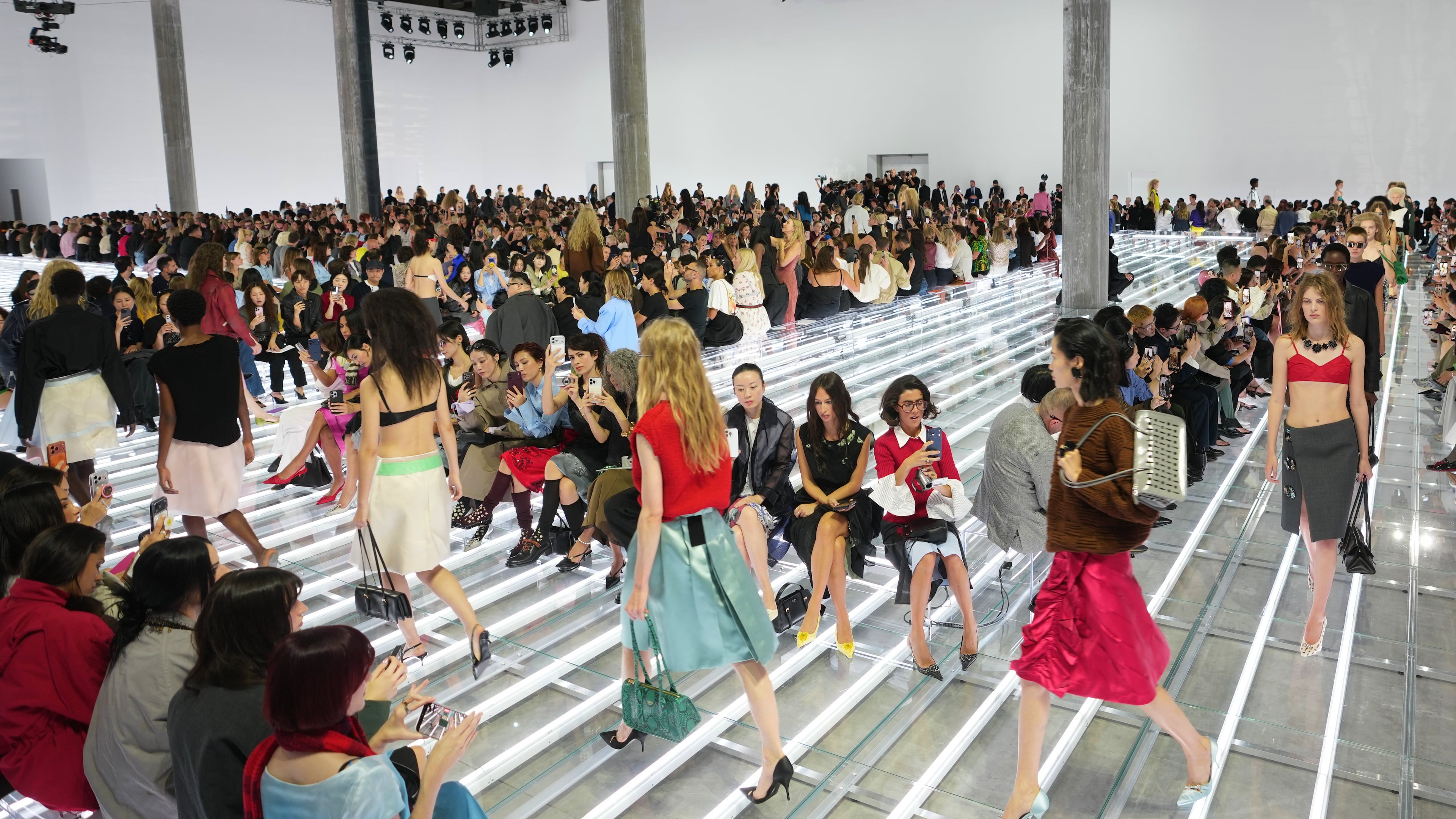 Models wear creations part of the Prada women's Spring-Summer 2027 collection presented in Milan, Italy, Tuesday, Sept. 22, 2026. (AP Photo/Luca Bruno).