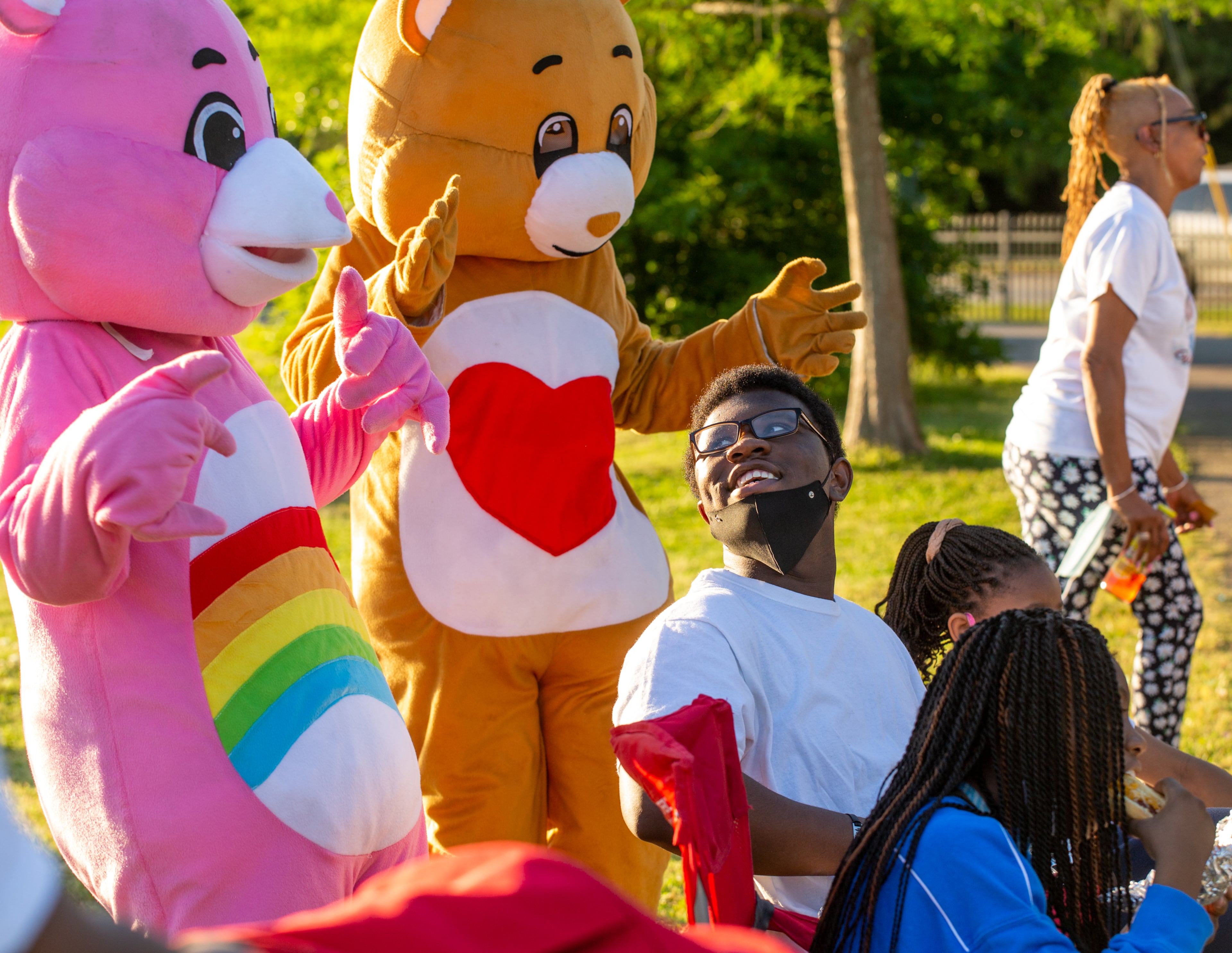 Because she loved Care Bears, dancing characters attended the vigil of Normisha “MiMi” Monroe on Saturday, May 1, 2021, at Club Drive Park in Lawrenceville where Daquan Wright, 17, seated, keeps an eye on the characters. The gathering was to celebrate the life of the 38-year-old, who died along with five other women in a passenger van crash on I-85 a week earlier. (Photo: Jenni Girtman for The Atlanta Journal-Constitution)