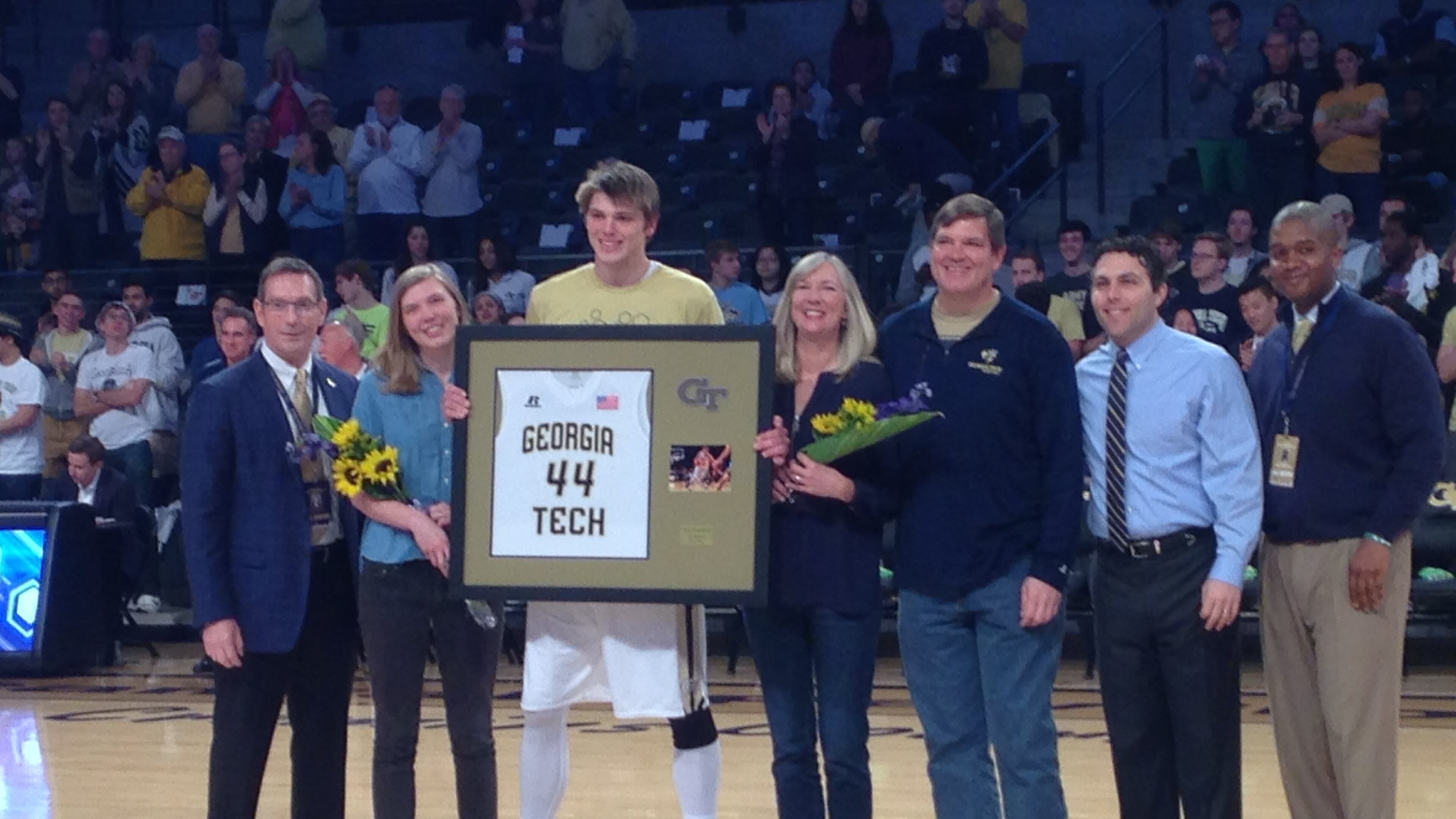 Former Georgia Tech center Ben Lammers with his family, athletic director Todd Stansbury, coach Josh Pastner and associate AD Marvin Lewis on senior day on March 3, 2018, at McCamish Pavilion. (AJC photo by Ken Sugiura)