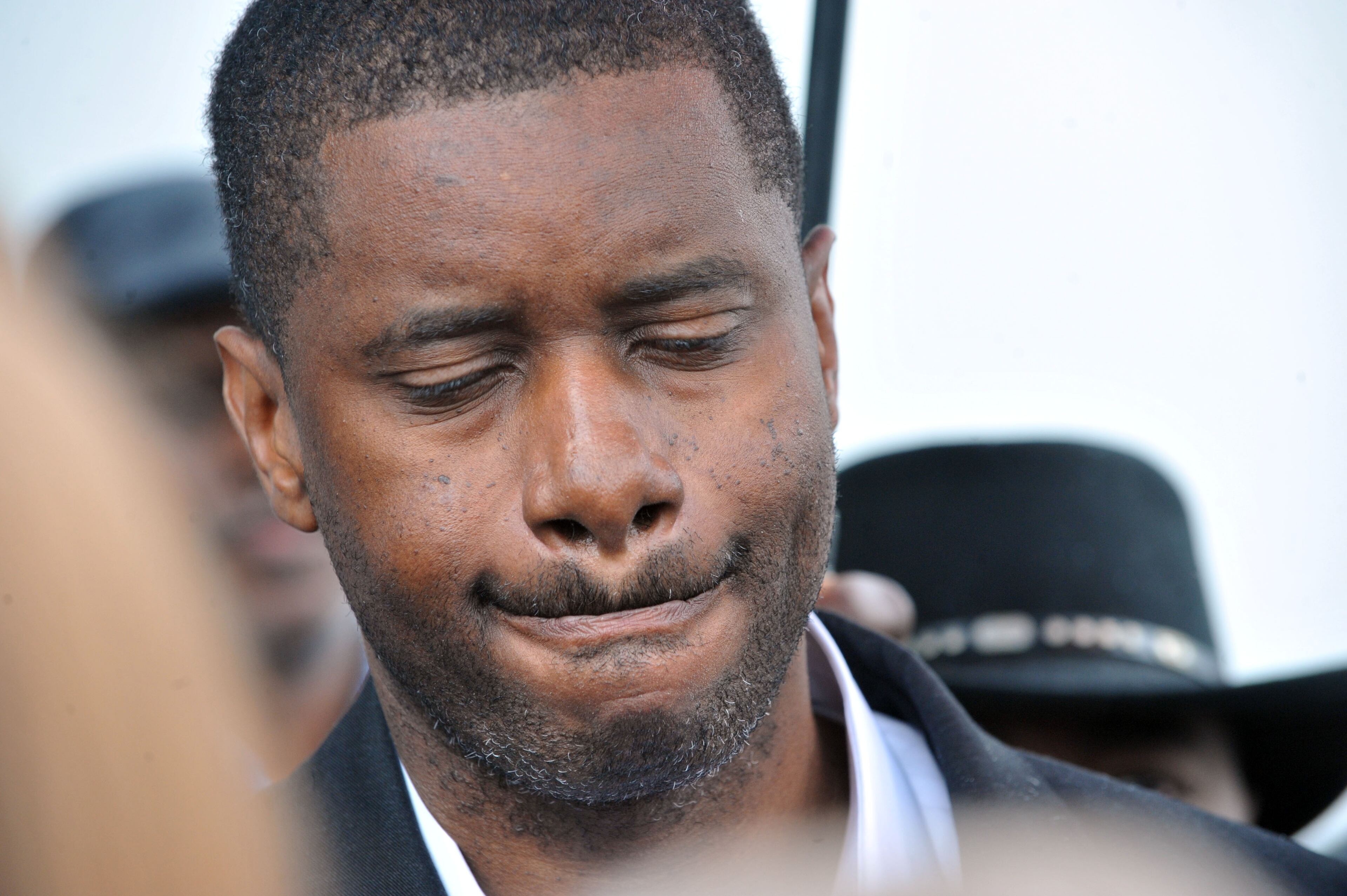 John McNeil closes his eyes during a short prayer offered after his release.
