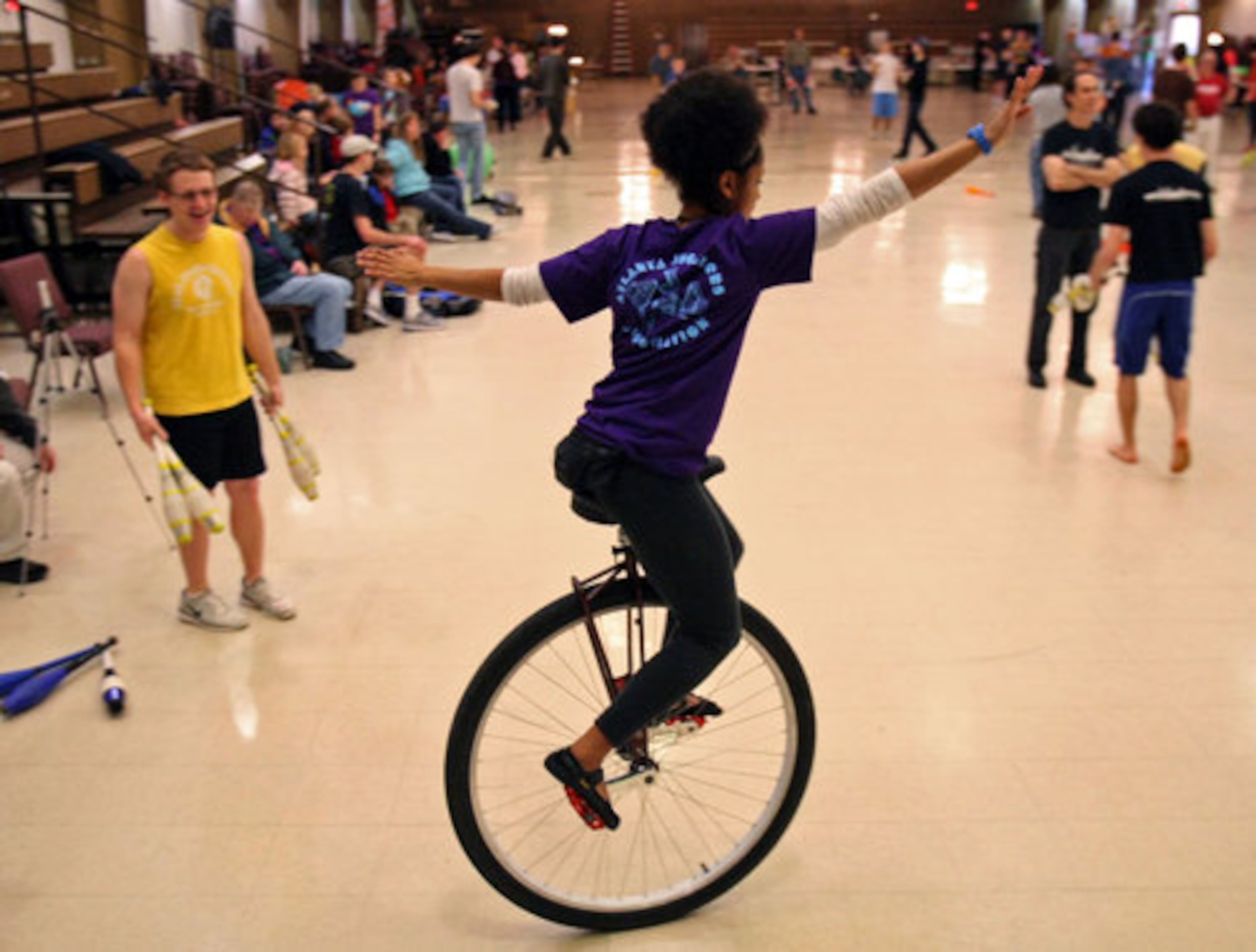Shivella Rogers, of Jacksonville, tries out her skills on a large-wheel unicycle during the 33rd Annual Groundhog Day Jugglers Festival.