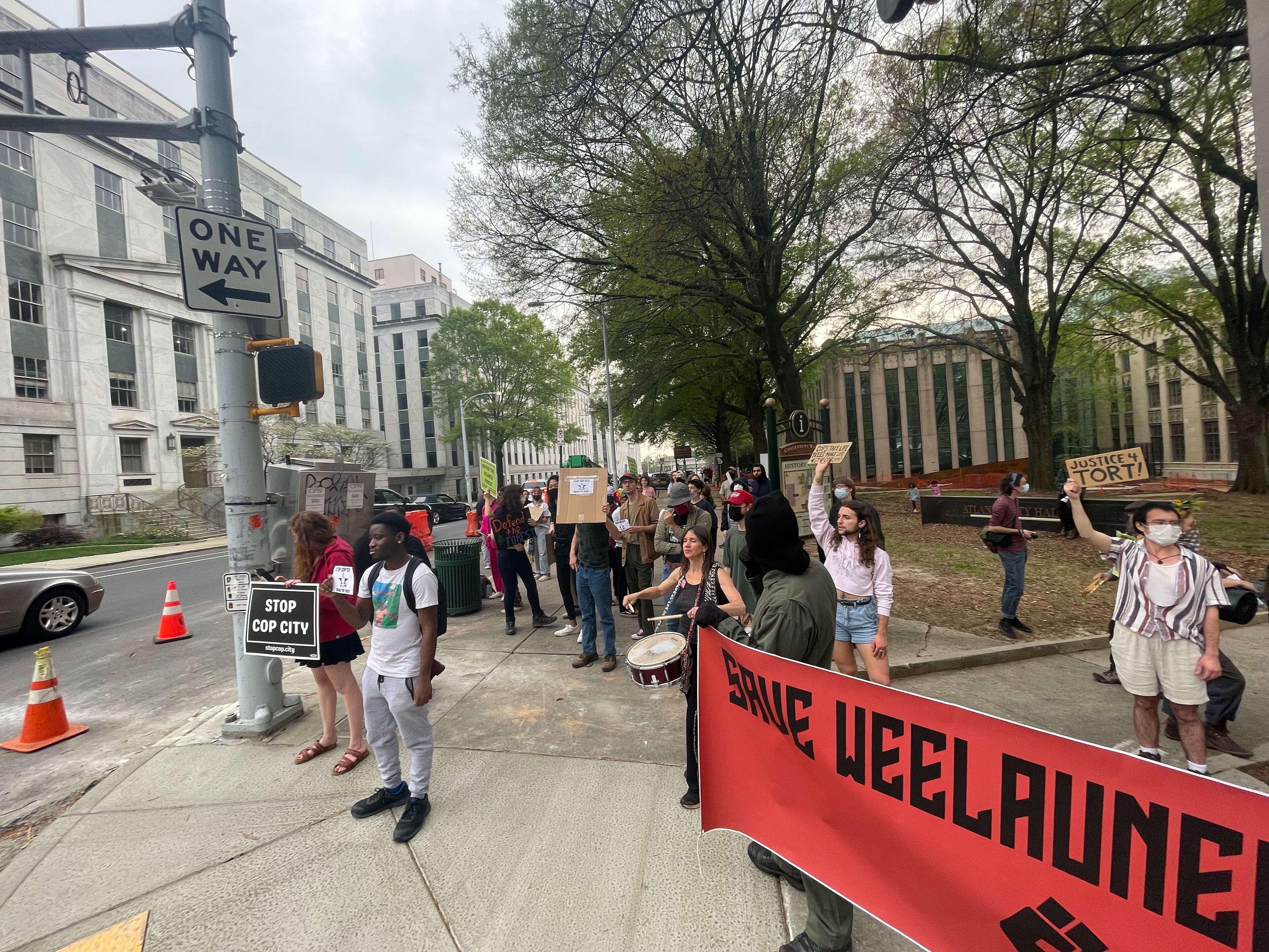 More than 60 people marched around Atlanta City Hall on Friday, March 31, 2023, to protest the ongoing work to build a public safety training center on 85 acres of wooded property in south DeKalb County.