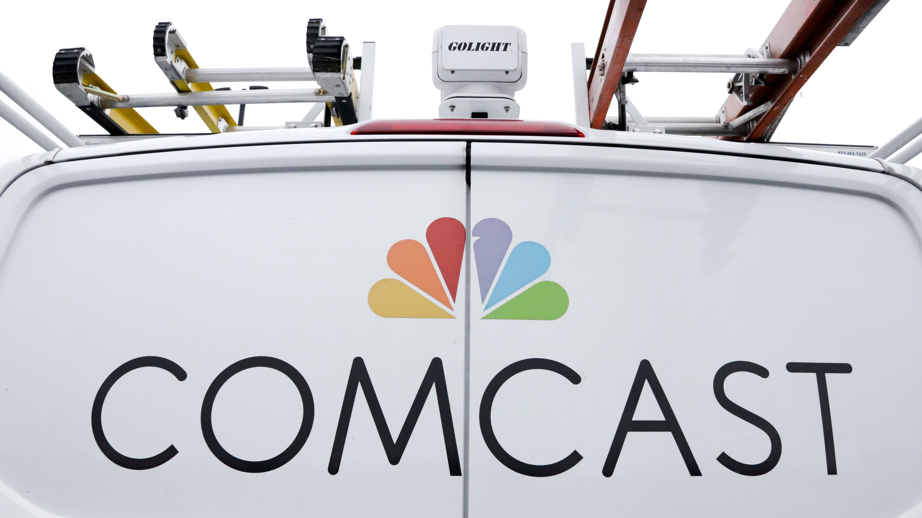 FILE- A Comcast truck is shown on Jan. 24, 2019, in Pittsburgh. (AP Photo/Gene J. Puskar, File)