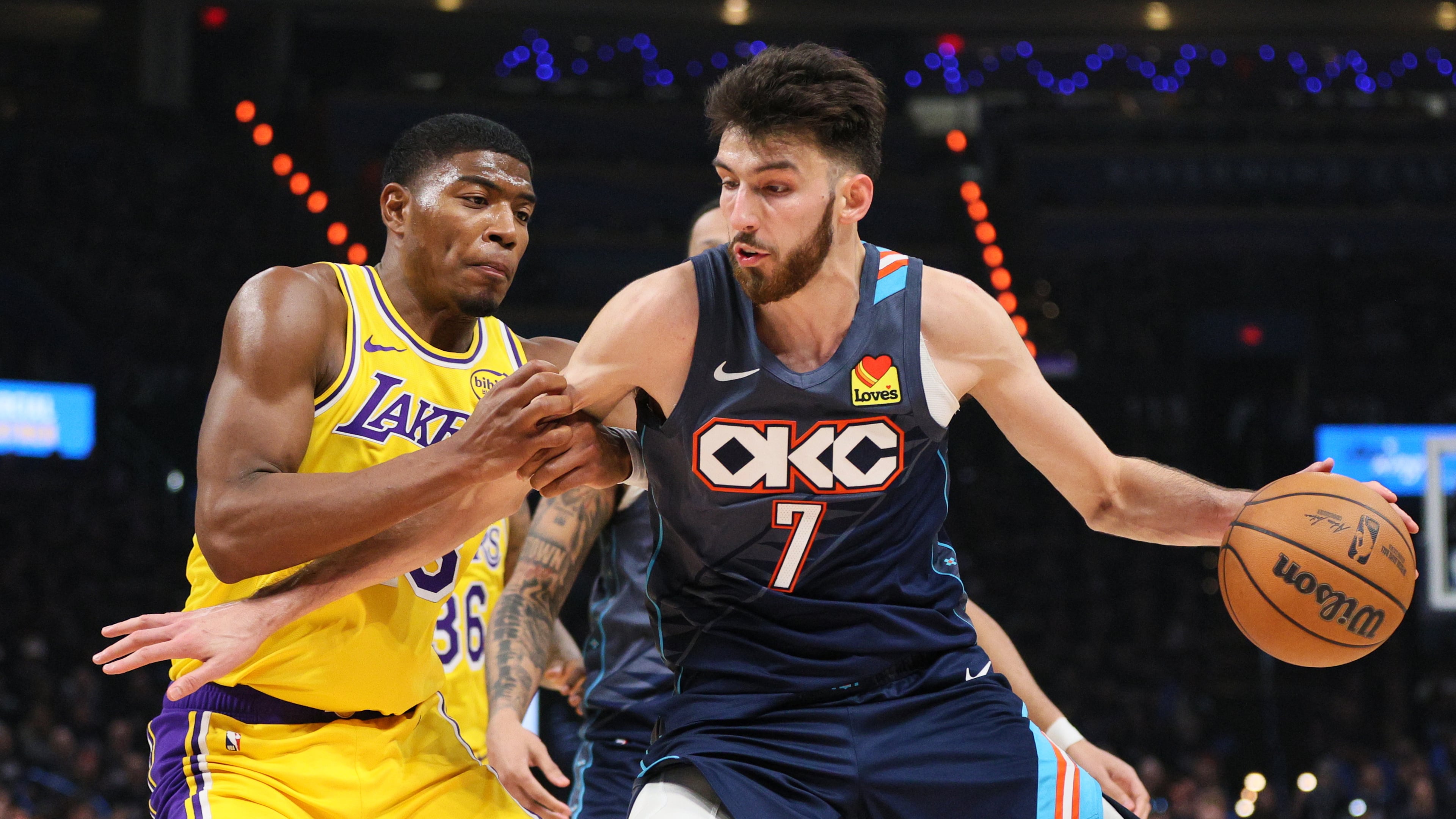 Oklahoma City Thunder center Chet Holmgren (7) works to the basket against Los Angeles Lakers forward Rui Hachimura (28) in the second half of Game 2 in a second-round NBA basketball playoffs series Thursday, May 7, 2026, in Oklahoma City. (AP Photo/Nate Billings)