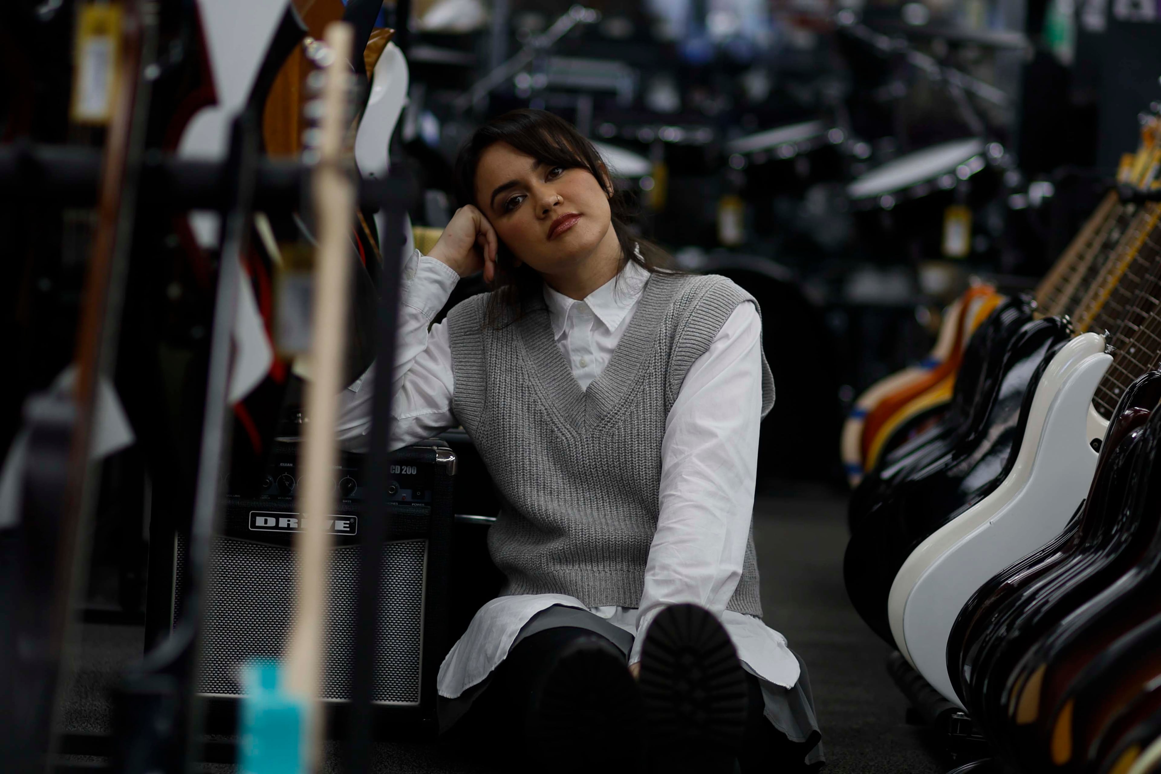 Singer Csndra visits Music Go Round, a music shop she frequents for inspiration, on Wednesday, Jan. 21, 2026, in Duluth. Her breakout single, “Cuida,” established her as a rising voice in the Latin indie pop scene. (Miguel Martinez/AJC)