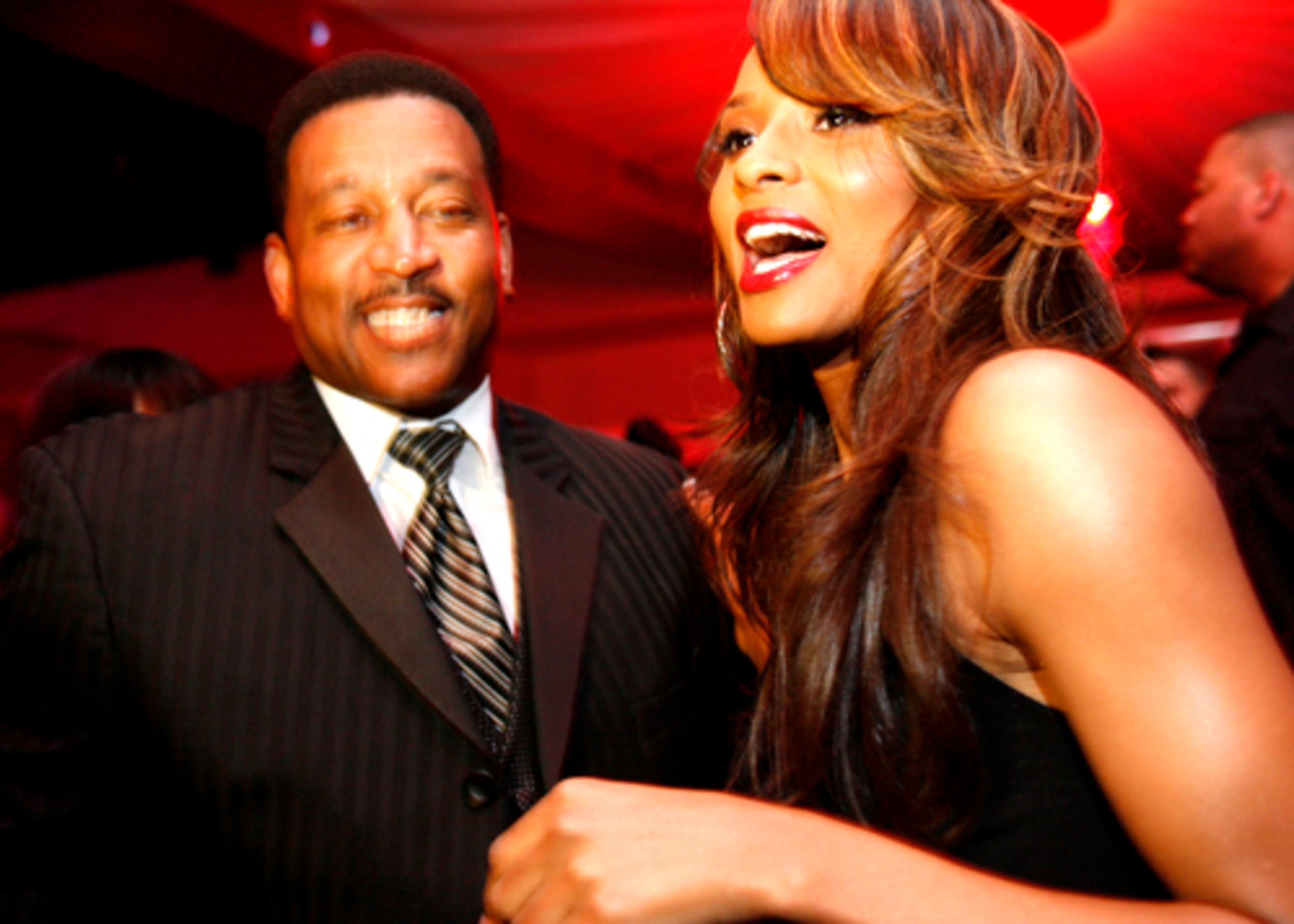 Ciara gets warm wishes from her father, Carlton Harris, who is the first to greet her in the Velvet Room's VIP area.