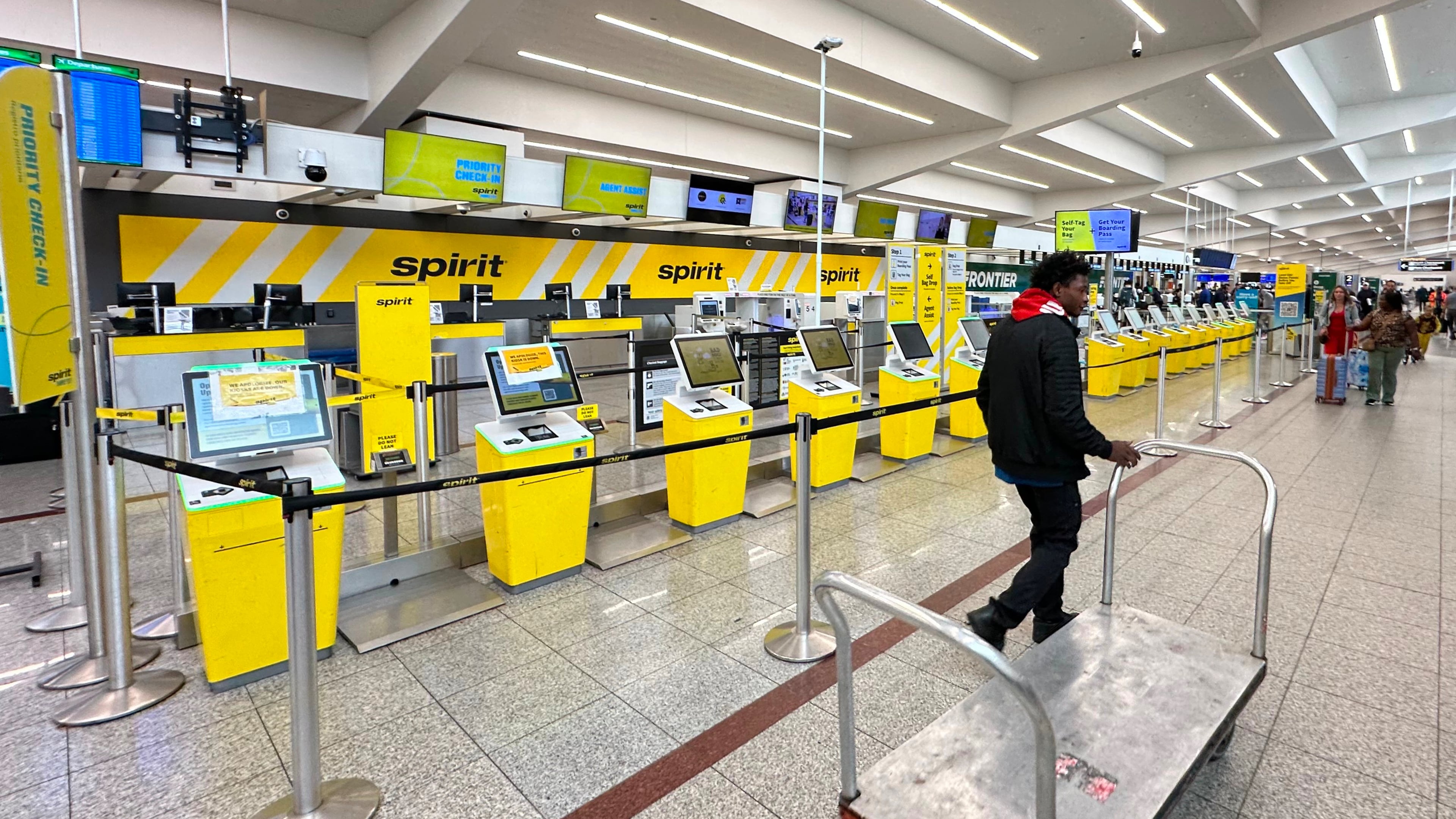 Spirit Airlines’ counter is passed by an airport employee after the airline’s shutdown on Saturday, May 2, 2026 at Hartsfield-Jackson Atlanta International Airport in Atlanta. (AP Photo/Jeff Amy)