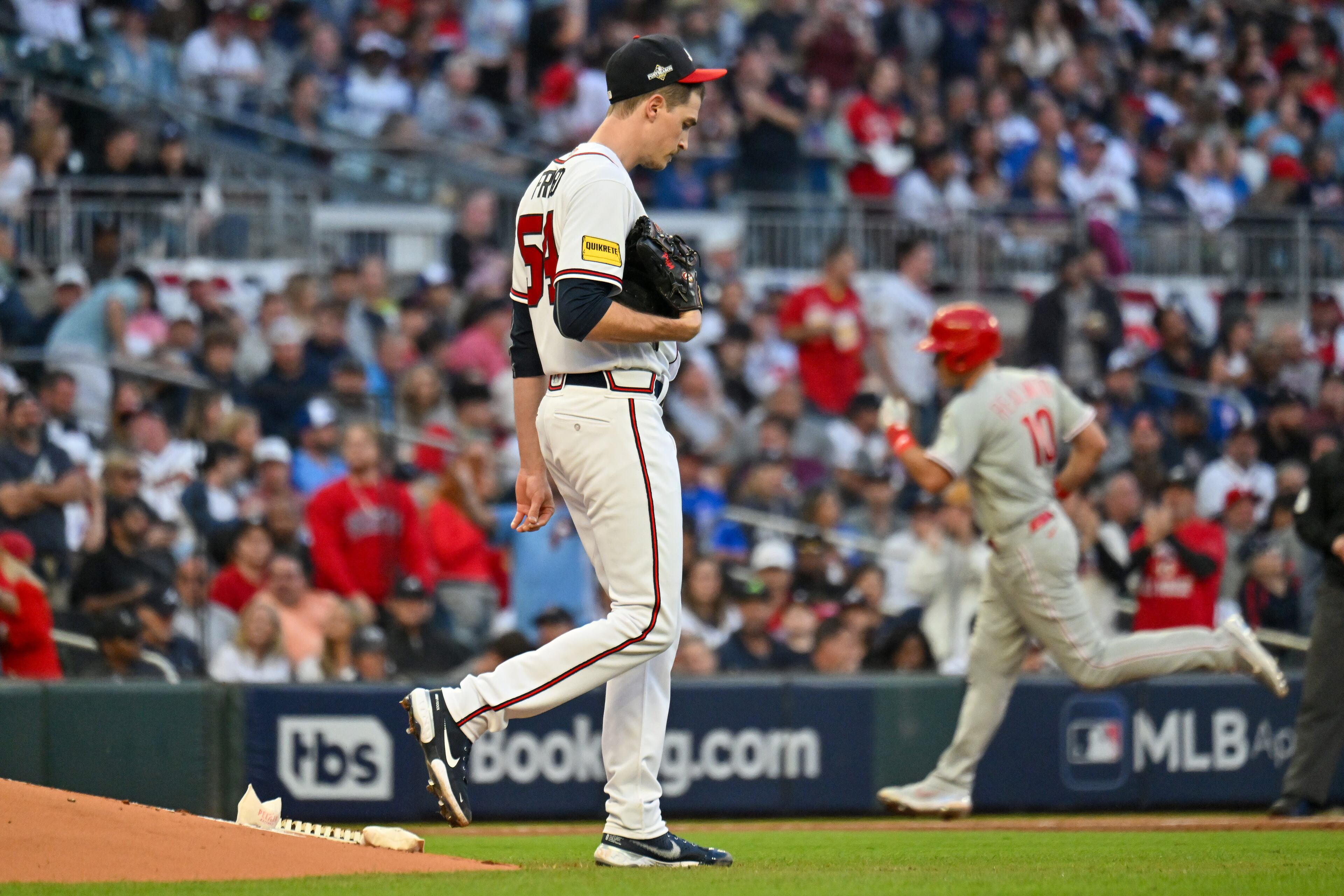 Atlanta Braves starting pitcher Max Fried (54) reacts as Philadelphia Phillies' J.T. Realmuto rounds third base on a home run during the third inning of the NLDS Game 2 in Atlanta on Monday, Oct. 9, 2023. (Hyosub Shin / Hyosub.Shin@ajc.com)