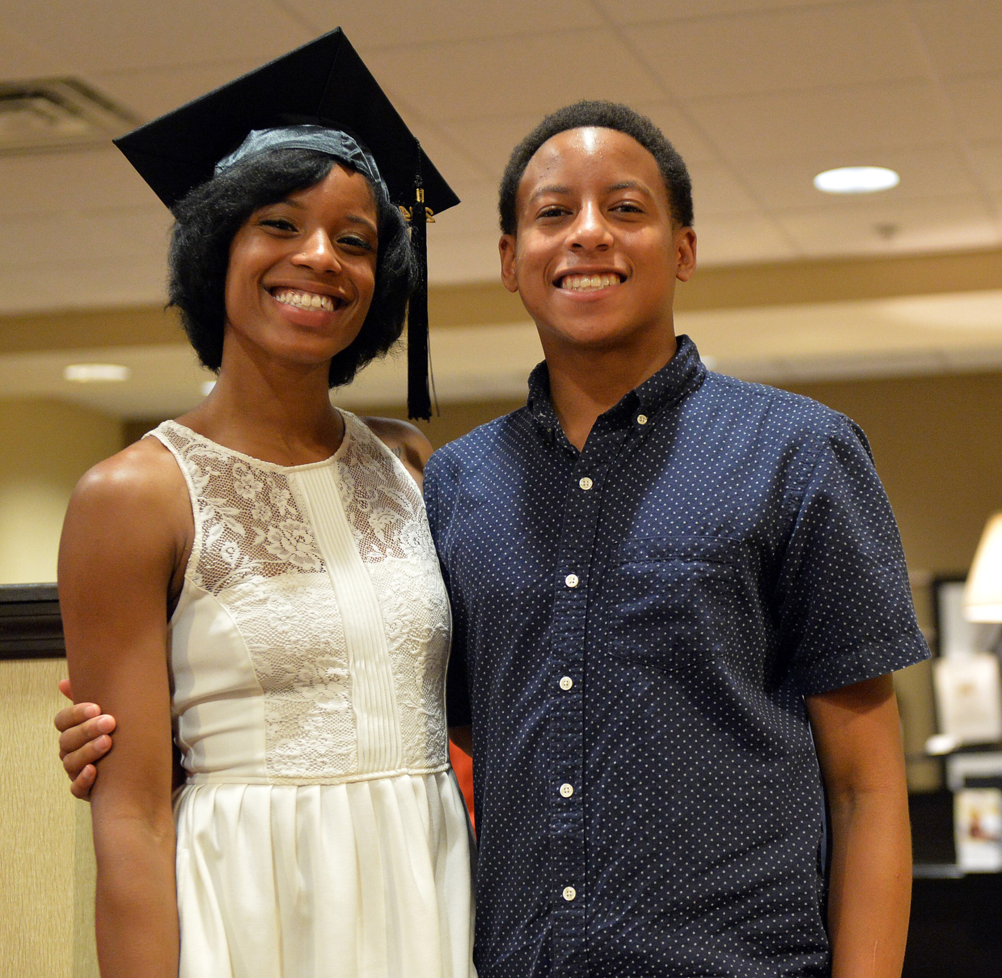 Tayla shares a moment with her brother Jeremiah, 17. KENT D. JOHNSON / KDJOHNSON@AJC.COM
