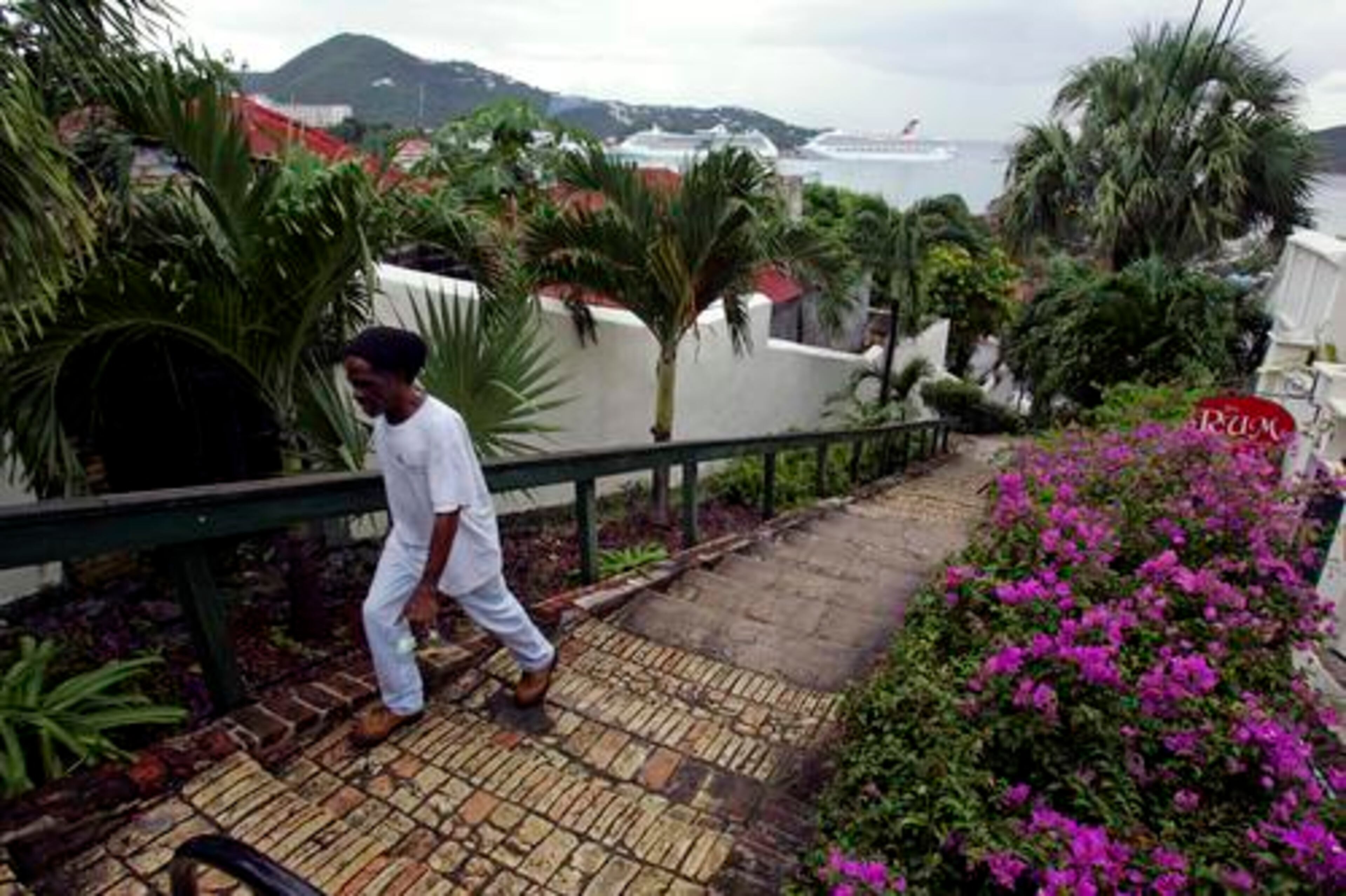 A man climbs the famed "99 Steps" made with bricks that were originally used as ballast on Danish ships on a hill overlooking Charlotte Amalie harbor in St. Thomas. The Virgin Islands spent more than two centuries as a Danish colony and slave trading port, a rich and bloody period whose history is being explored by an increasing number of Danish tourists.