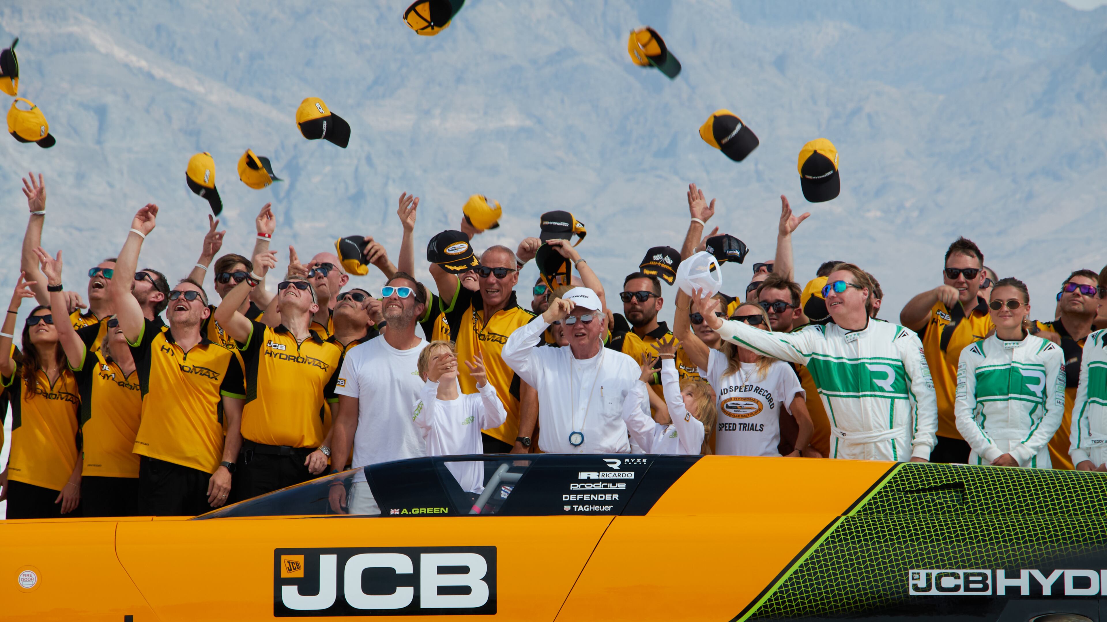British driver Andy Green, center, and the JCB engineering team celebrate setting a new land speed record for a hydrogen-powered vehicle at the Bonneville Salt Flats in Utah, Tuesday, Aug. 11, 2026. (AP Photo/Hannah Schoenbaum)