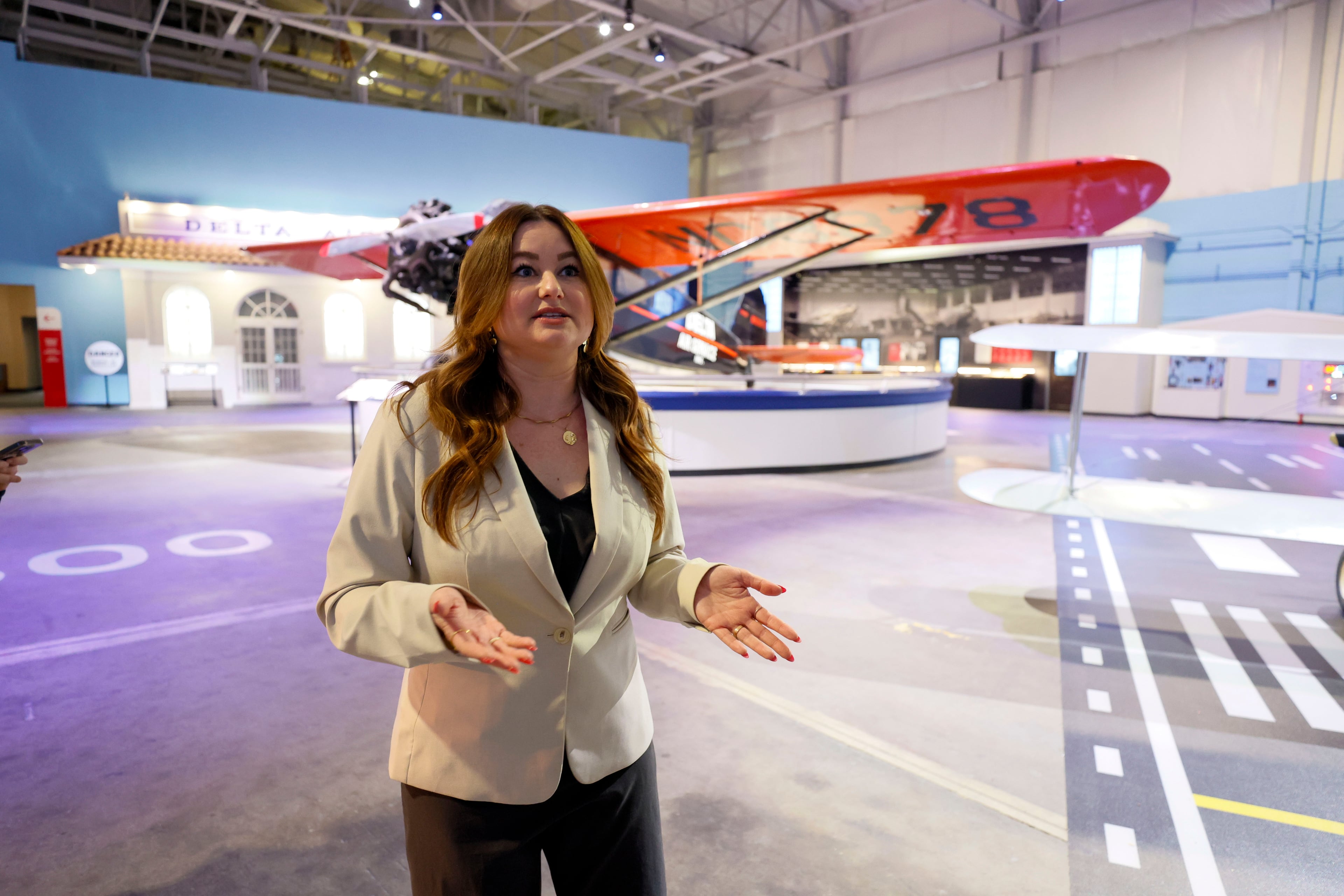 Nina Thomas, director of exhibits and public programs with Delta, speaks during a media tour of the Delta Flight Museum near Hartsfield-Jackson Atlanta International Airport on Tuesday, March 25, 2025. Thomas said “it just was time” for the museum's renovation. (Miguel Martinez/AJC)