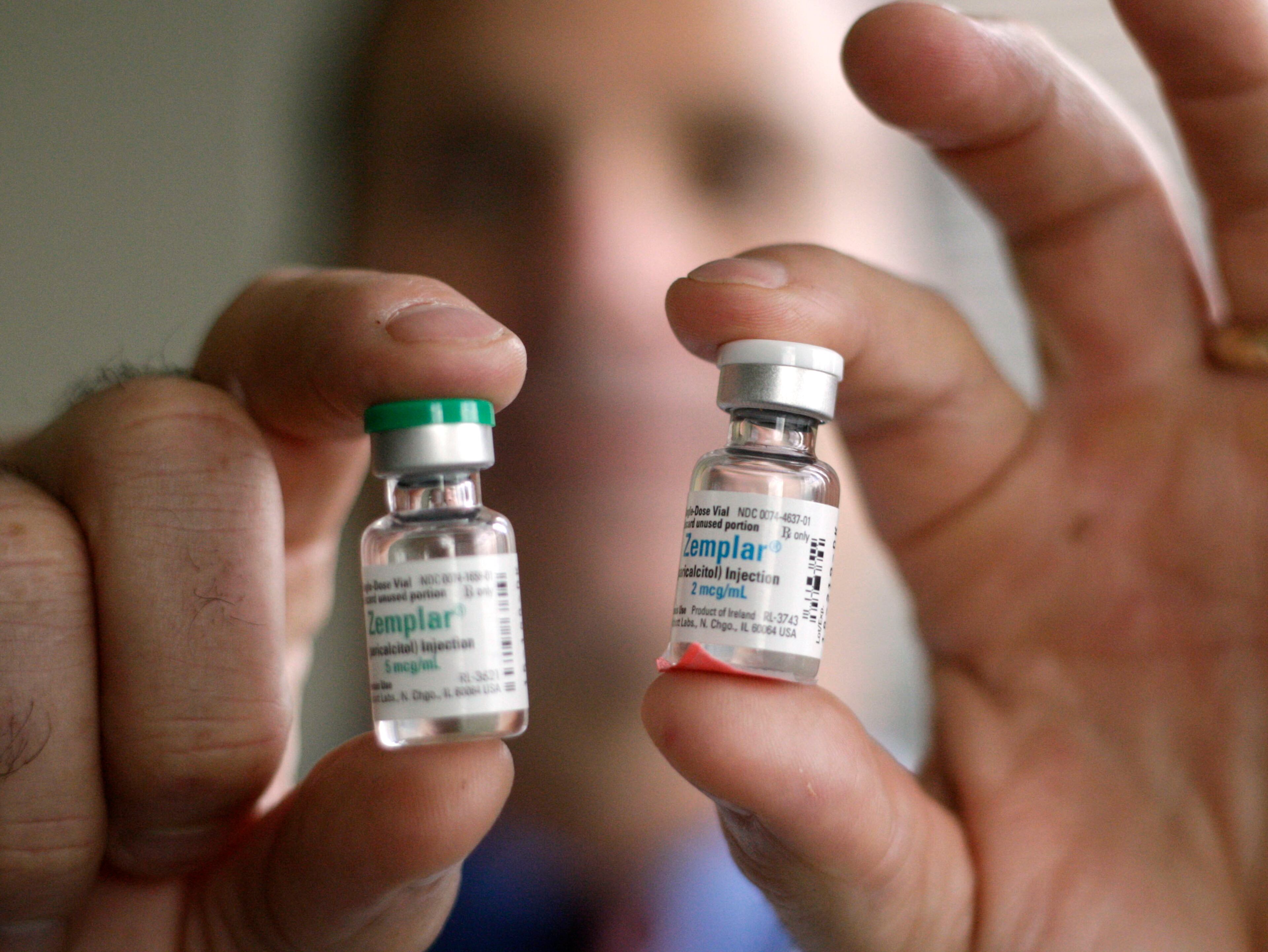 Dr. Alon Vainer holds samples of Zemplar, one of the medications he says was administered in a wasteful way. BOB ANDRES BANDRES@AJC.COM