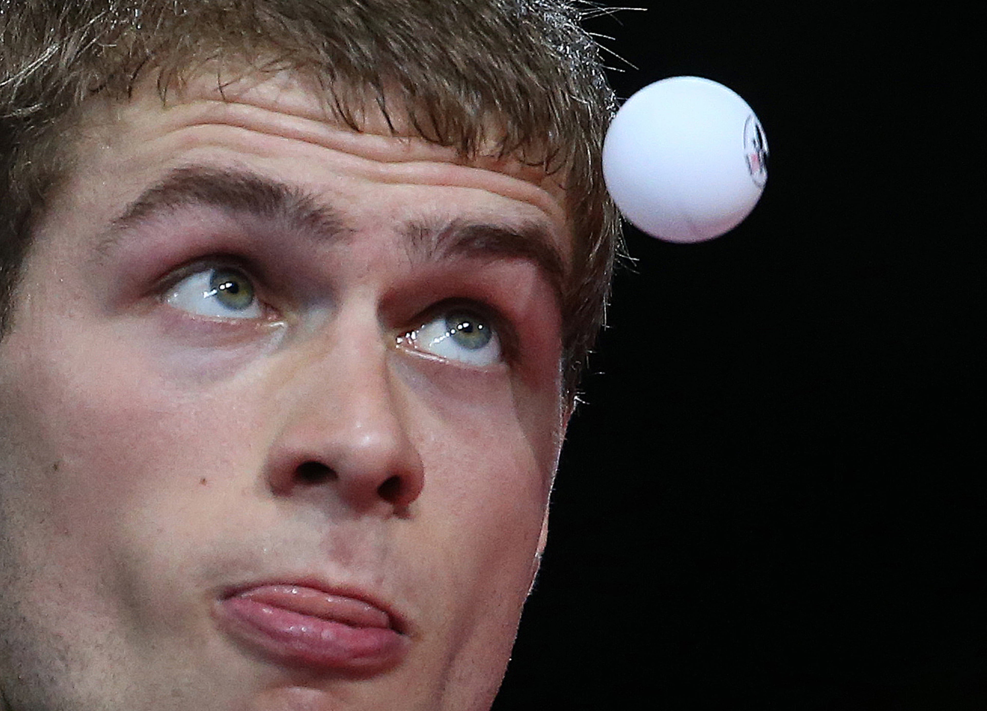 Canada's Pierre-Luc Theriault prepares to play a return to Uganda's Gilton Chelibe Charlotte in the Men's Table Tennis singles at the Commonwealth Games Glasgow 2014, Glasgow, Scotland, Tuesday, July 29, 2014.